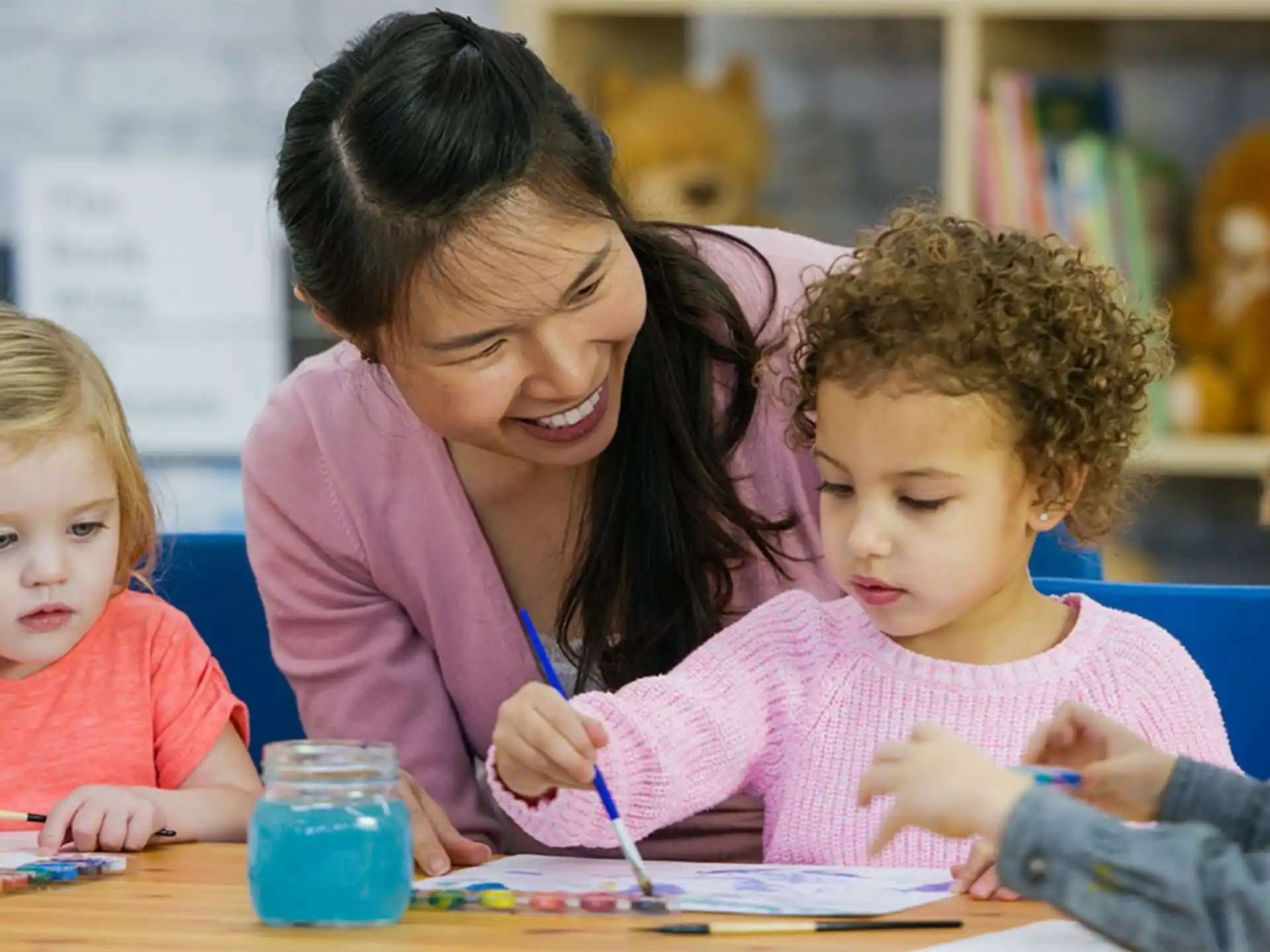 a person and children painting