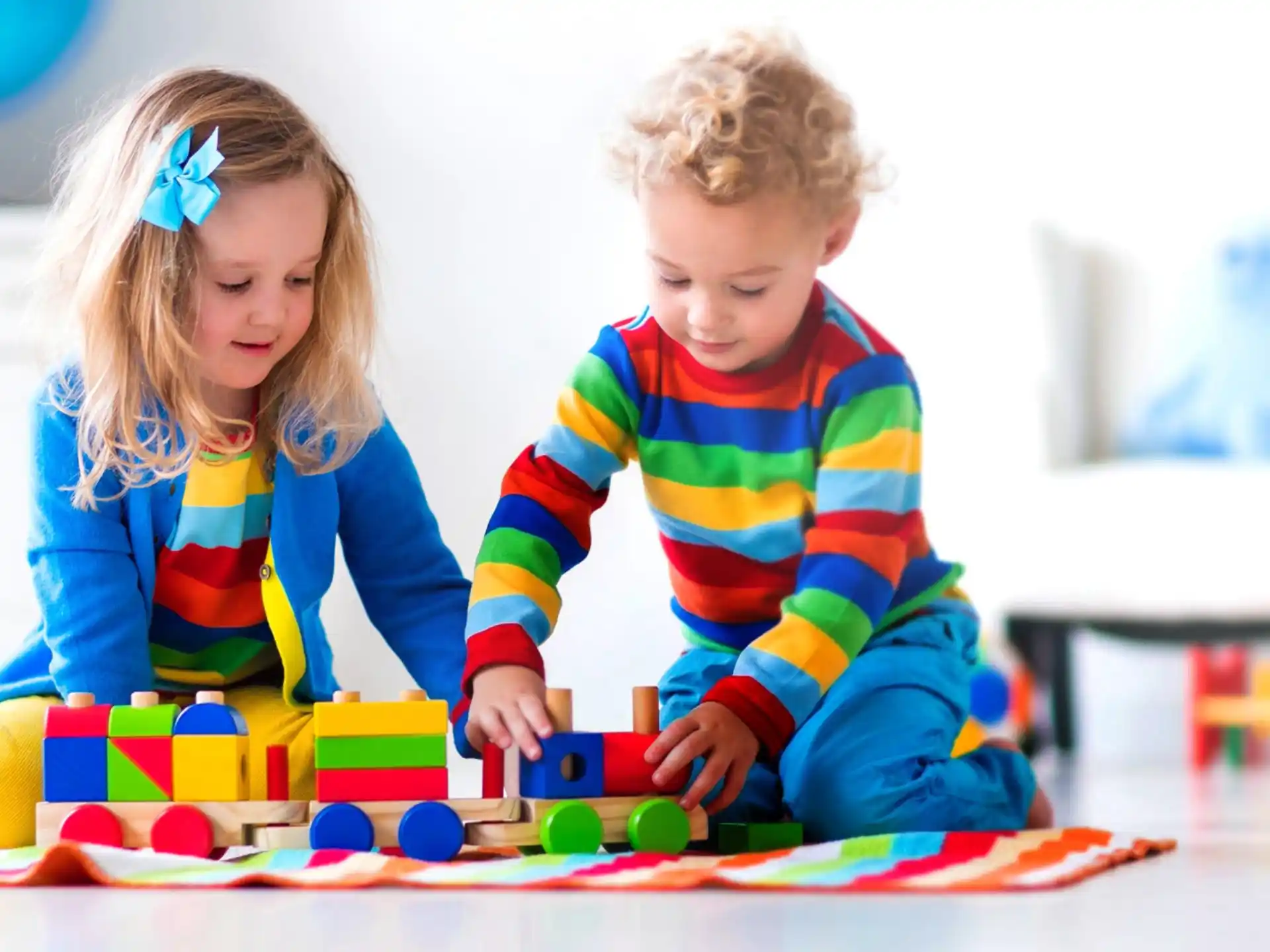 a couple of children playing with toys