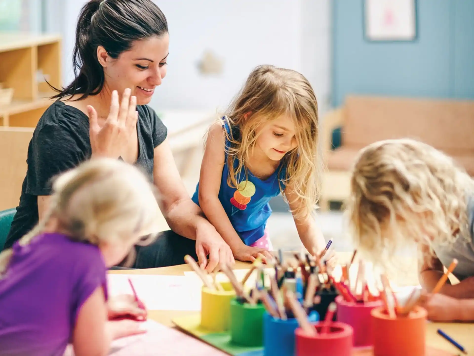 a group of children painting