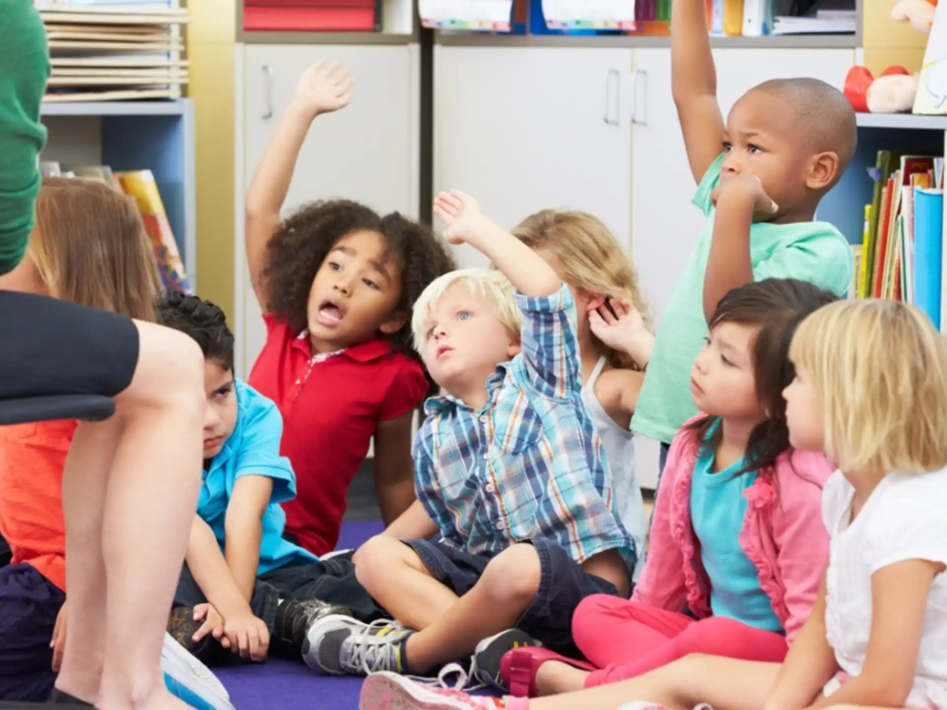a group of children sitting on the floor