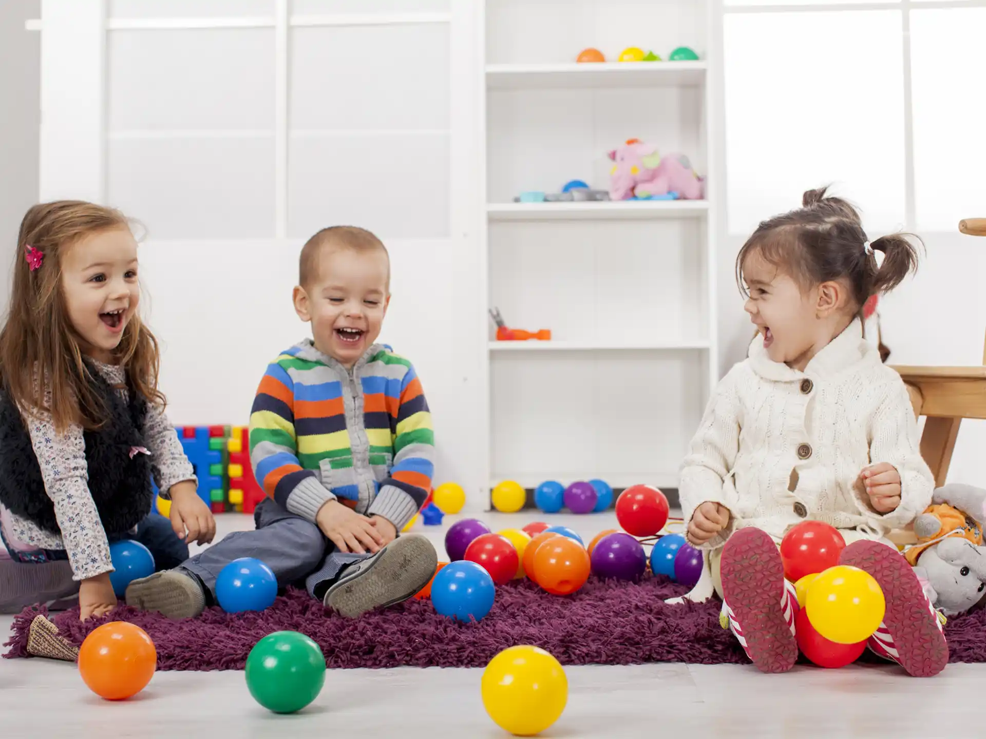 a group of children playing with balls