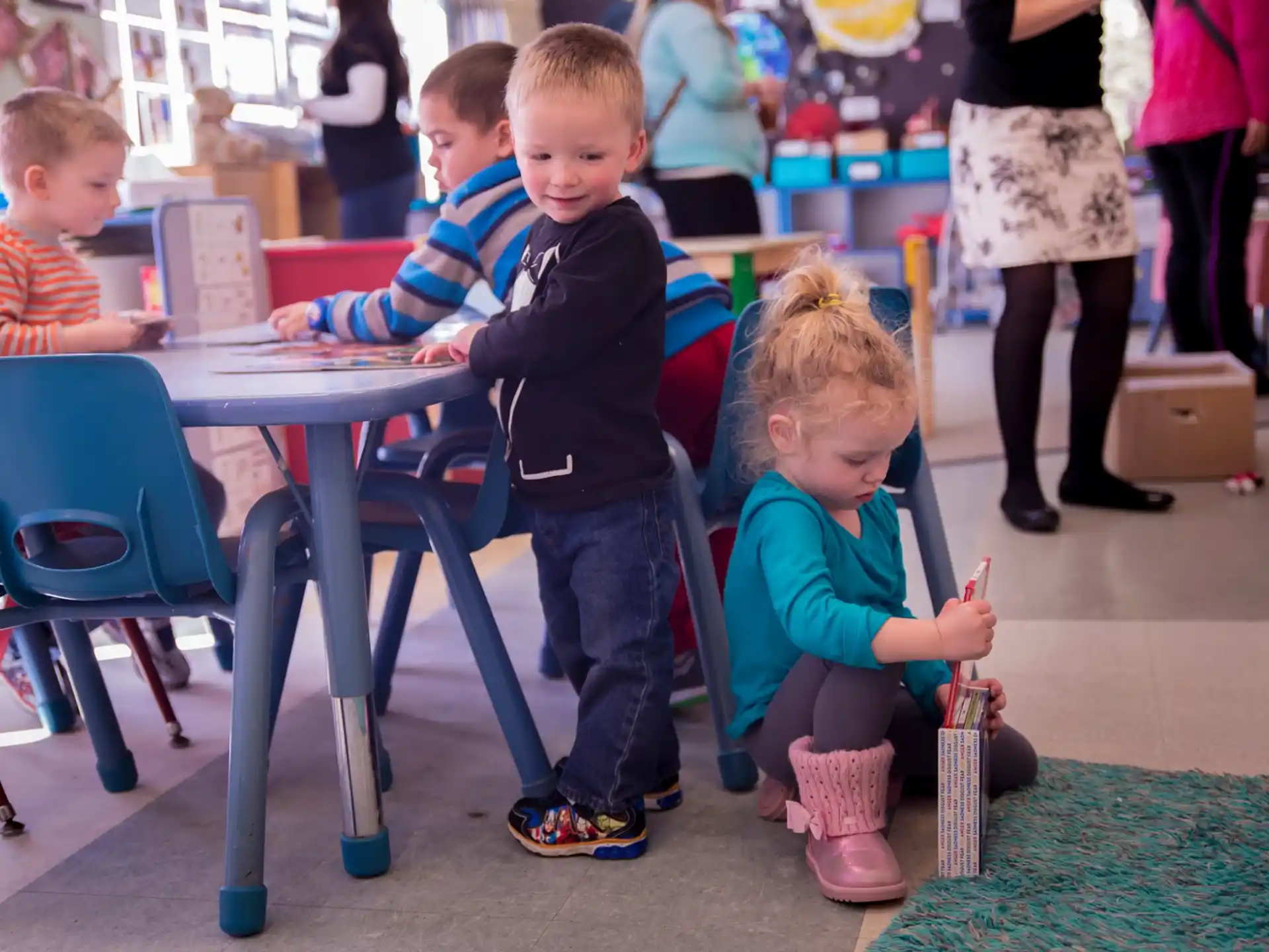 a group of children sitting at a table