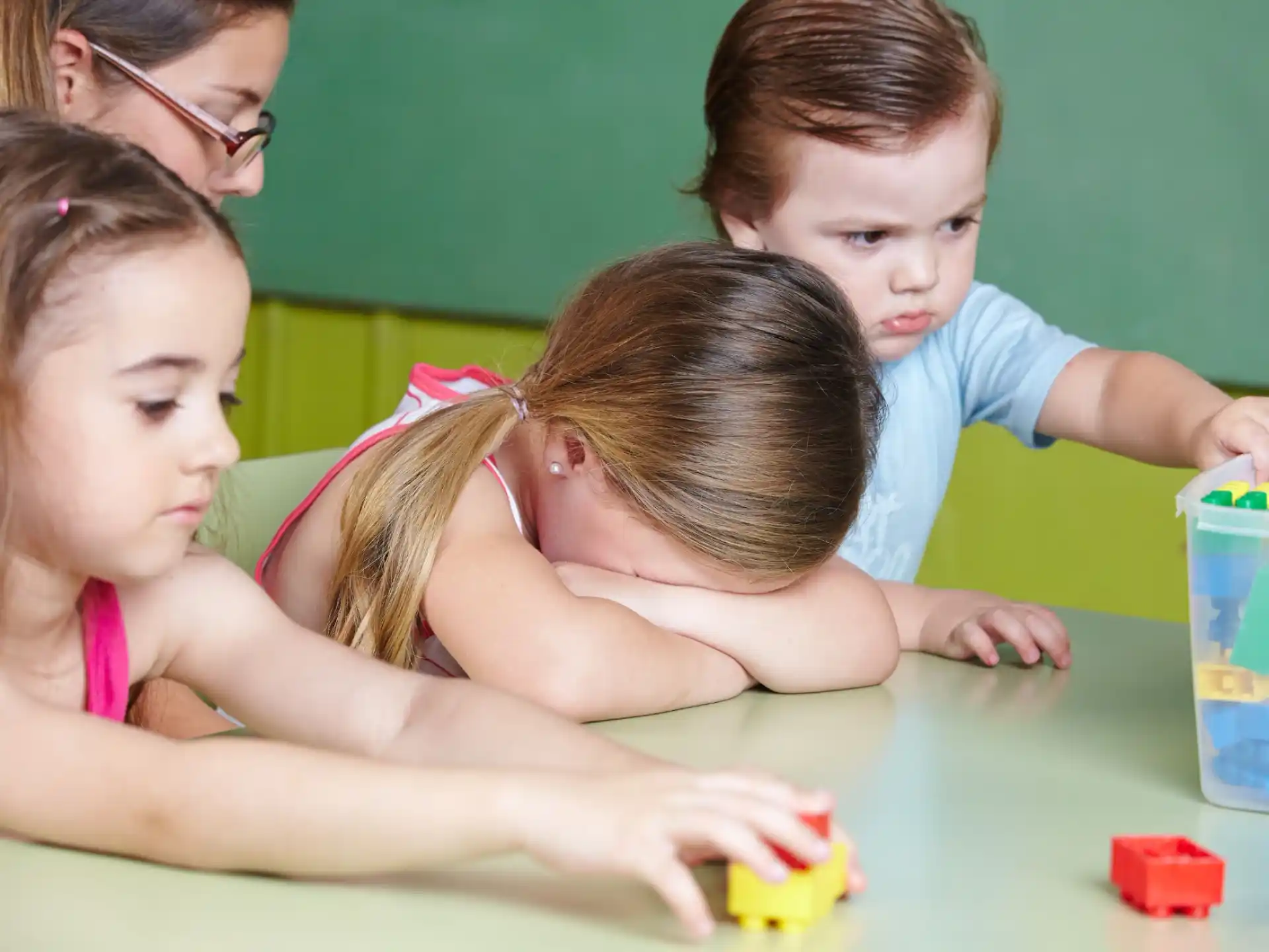 a group of children playing with toys