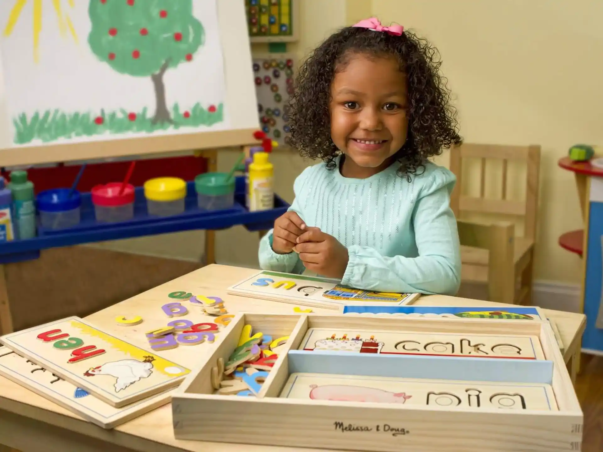 a girl sitting at a table