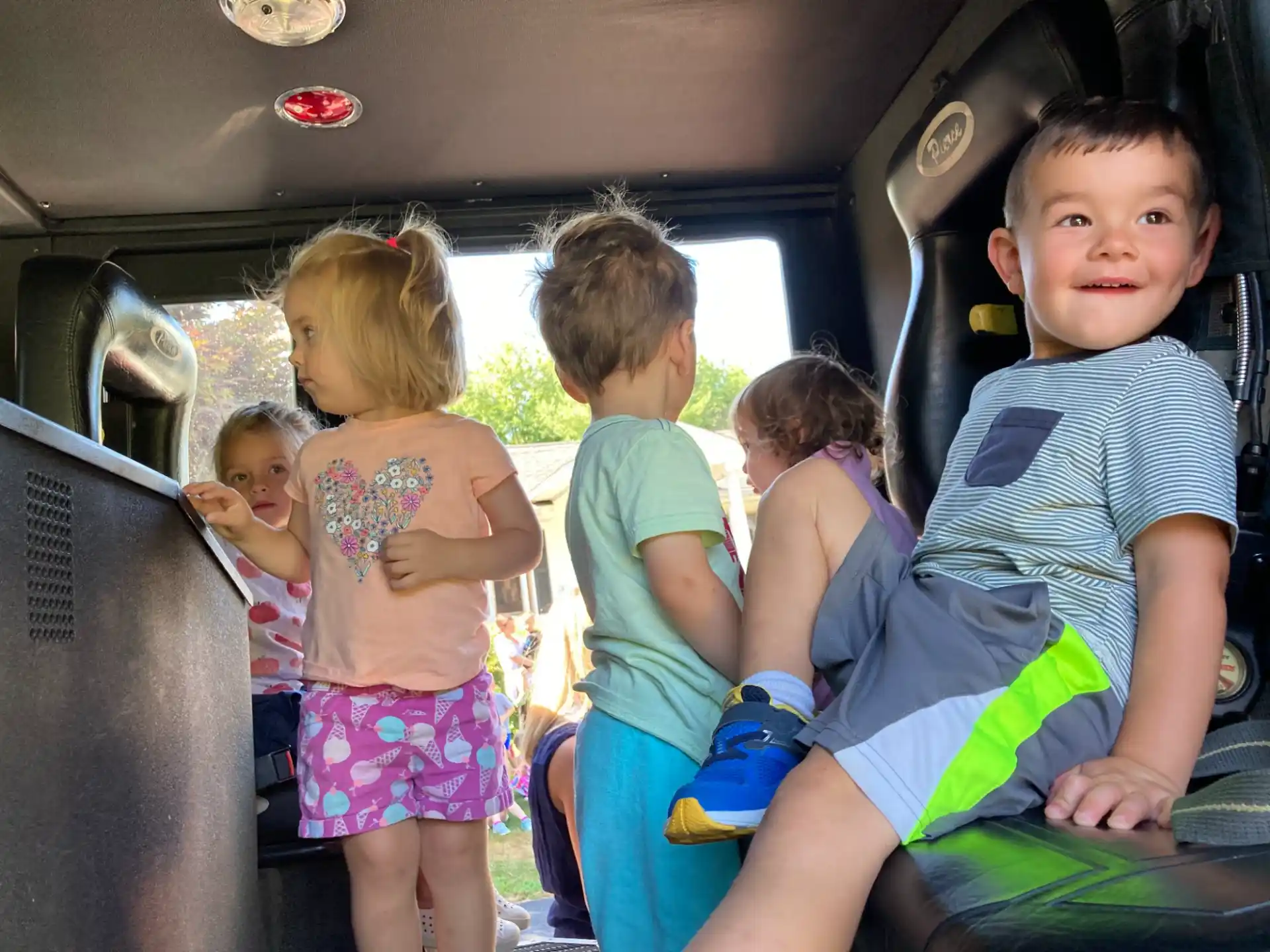a group of children in a car