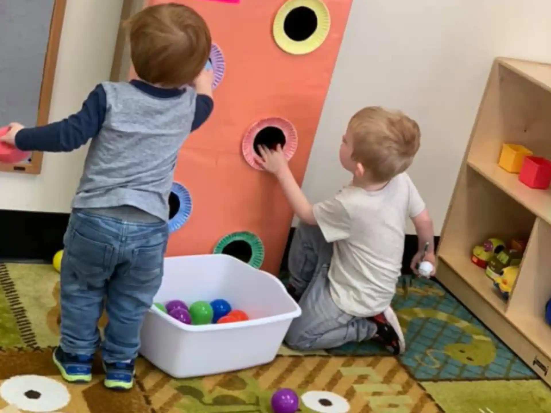 a couple of kids playing with toys