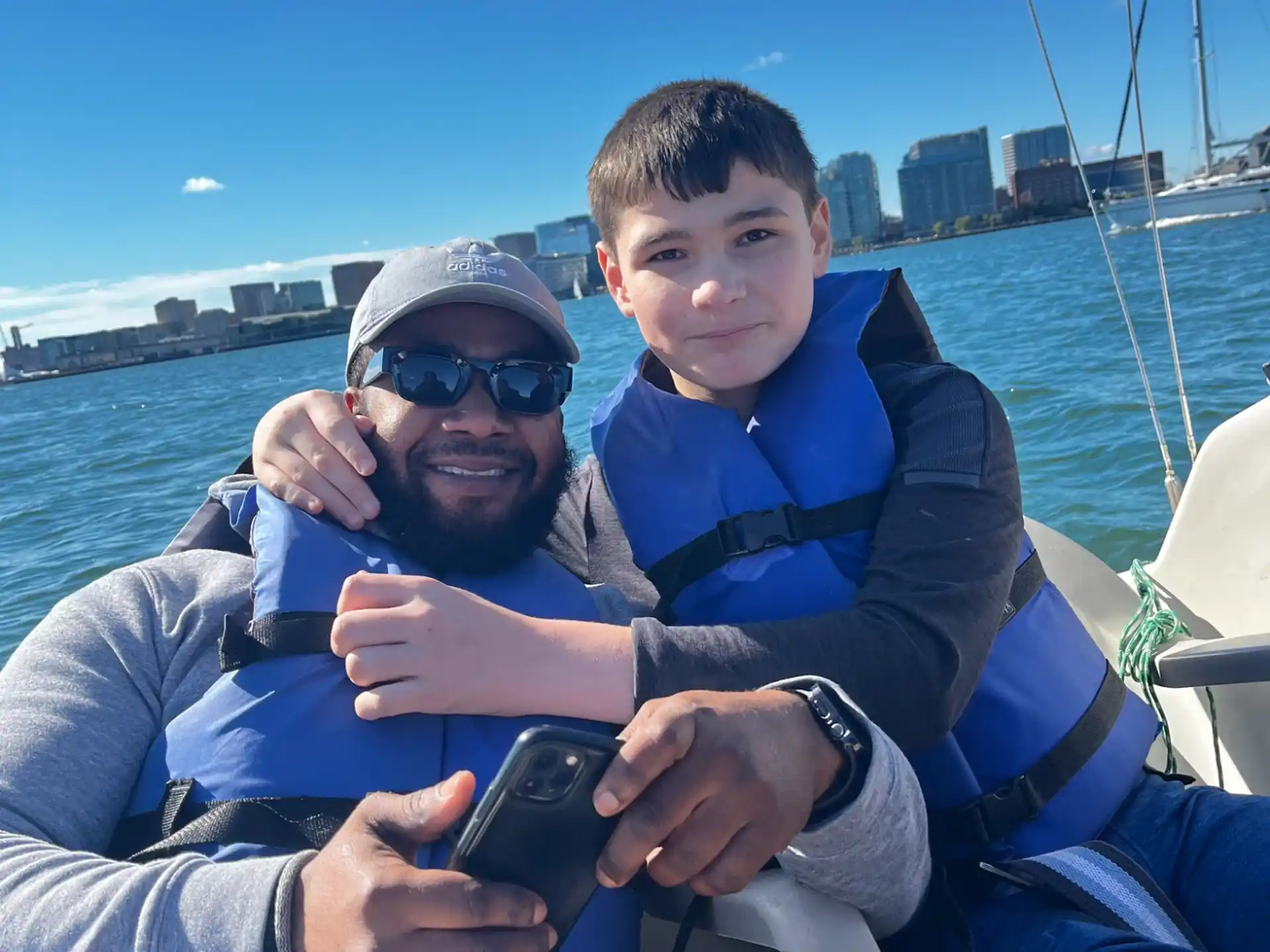 a person and a boy on a boat