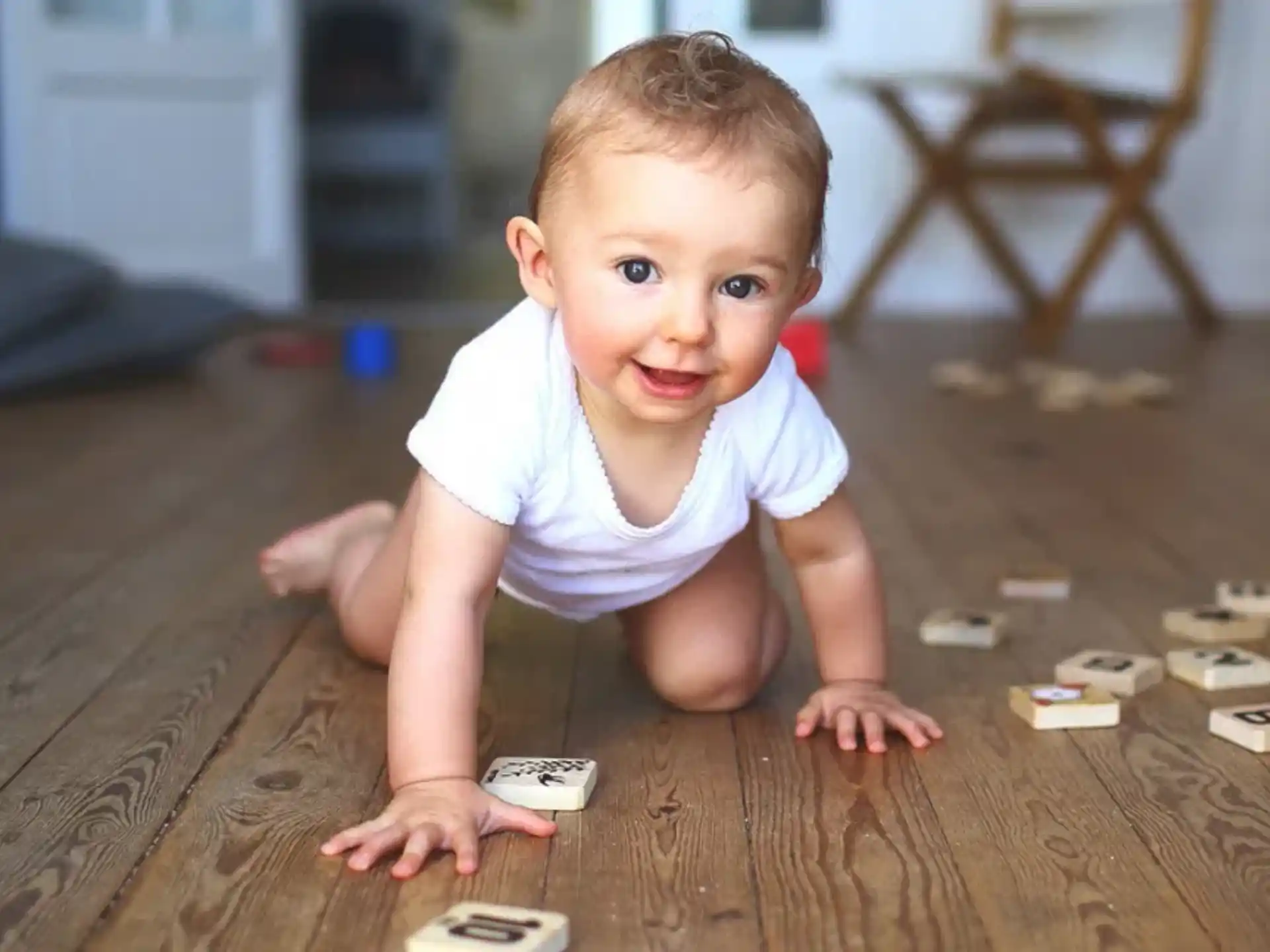 a baby crawling on the floor