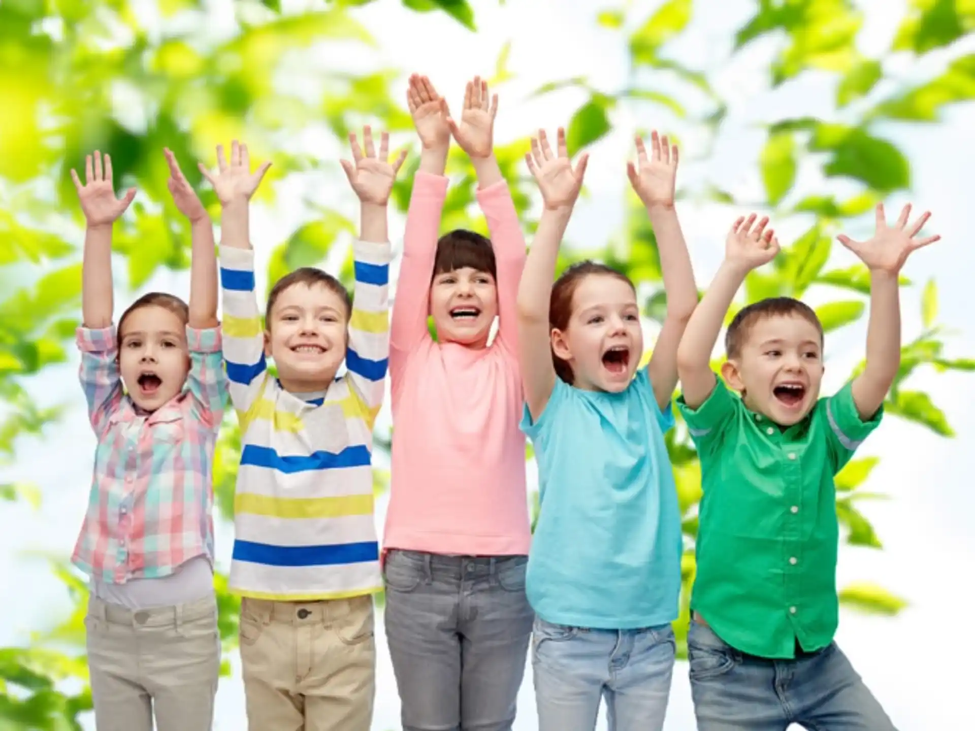a group of kids raising their hands