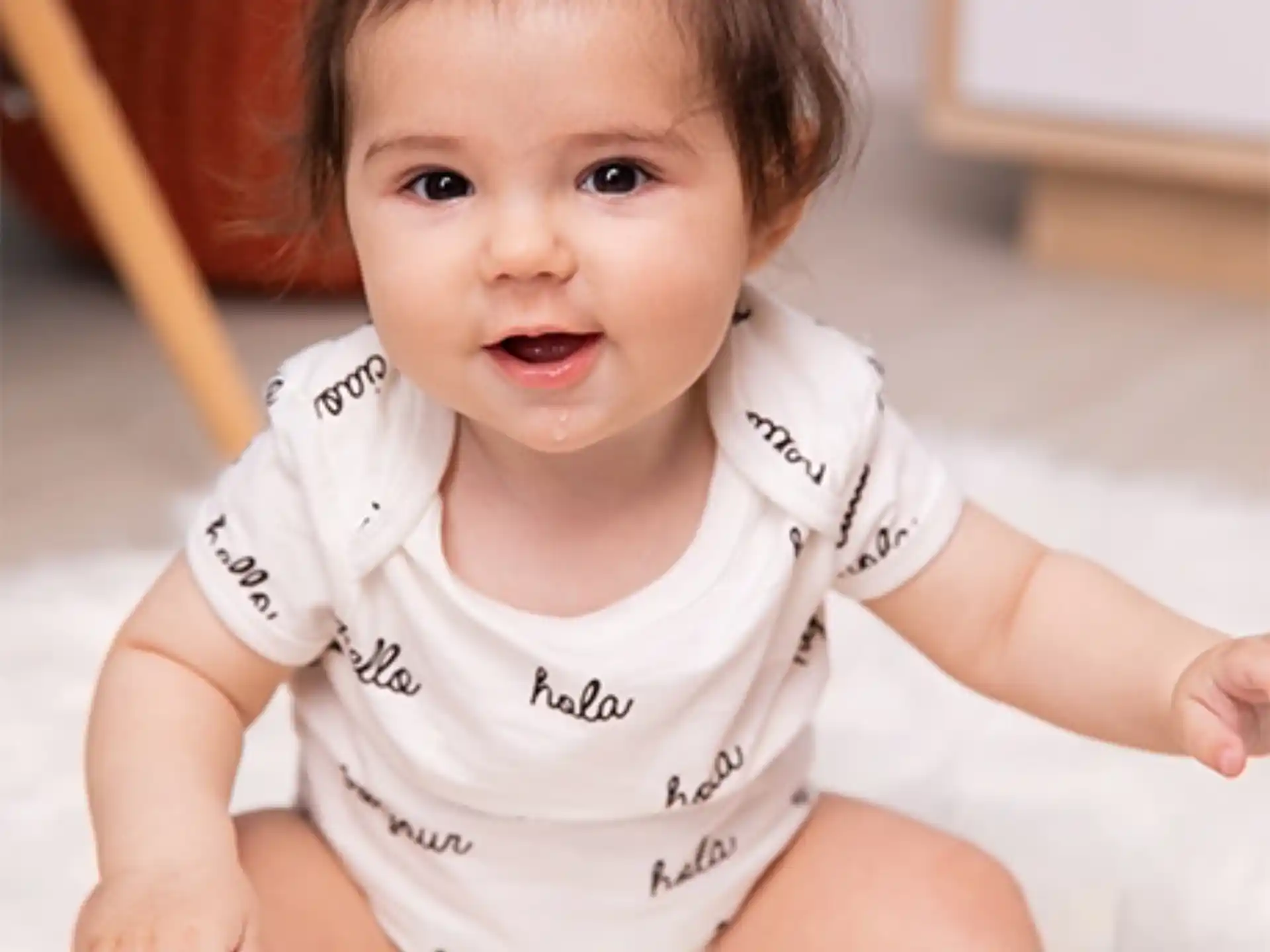 a baby lying on a bed