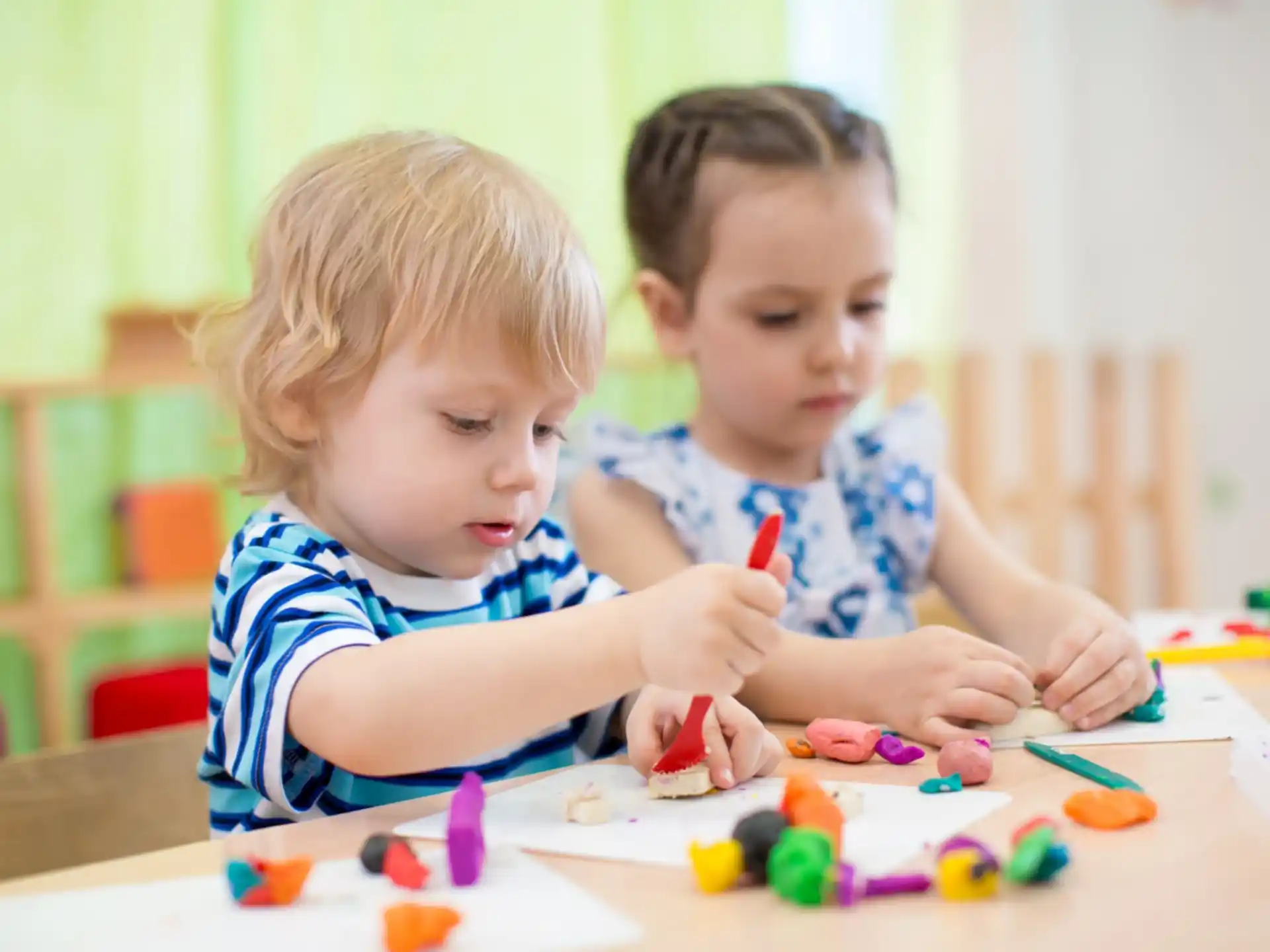 a couple of kids playing with toys