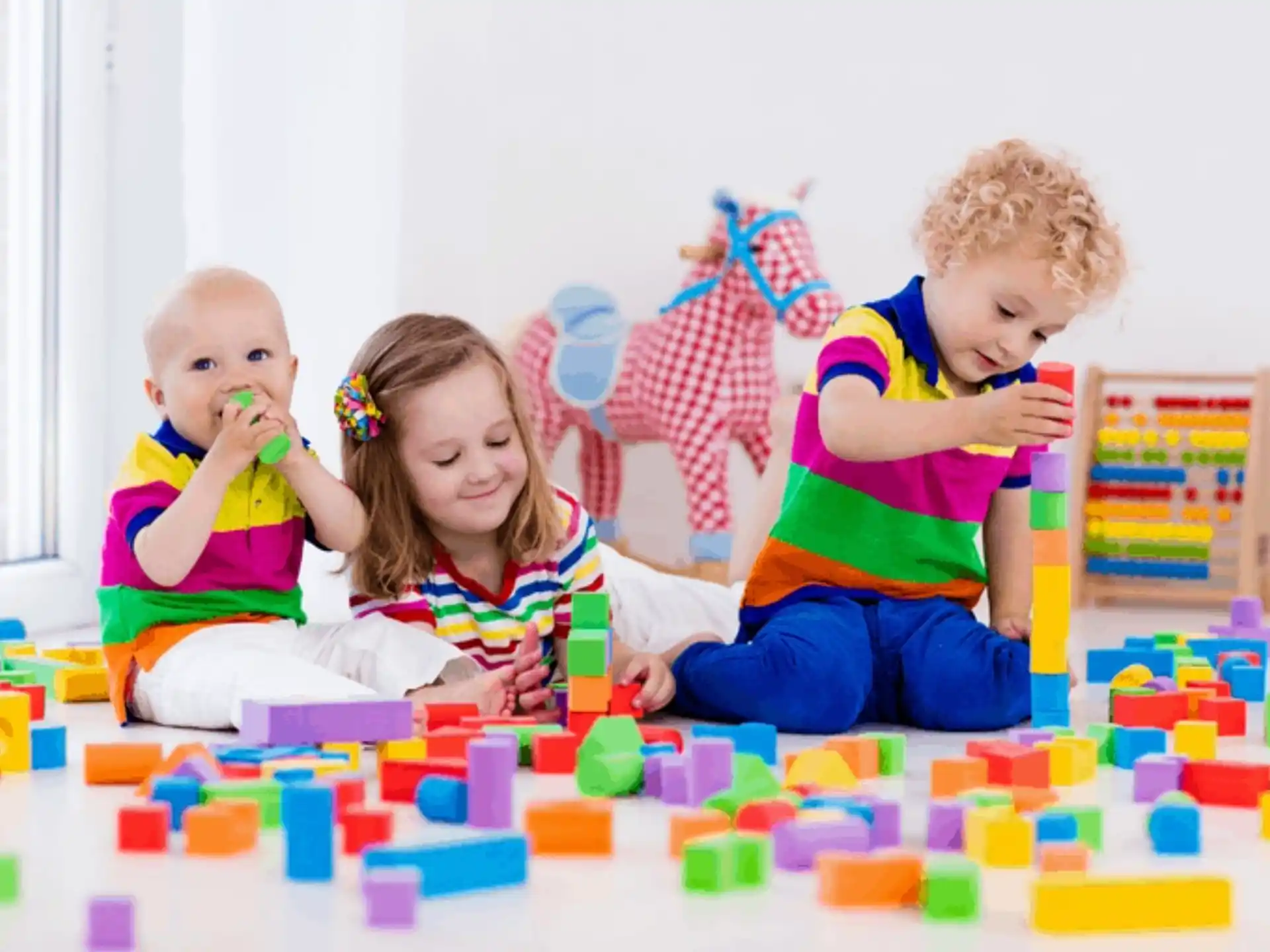 a group of children playing with toys