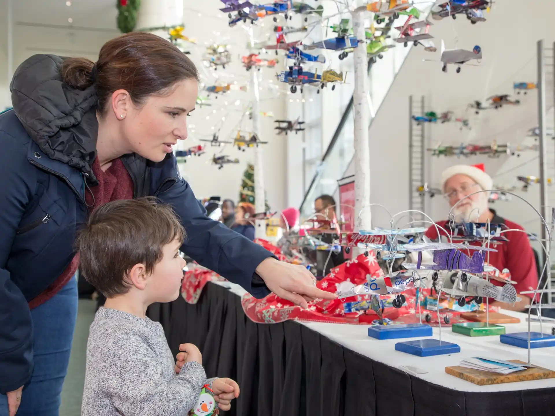 a person and a child playing with toys