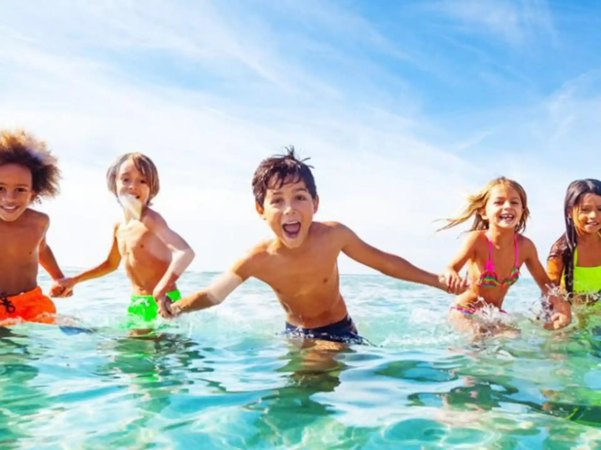 a group of children in the water