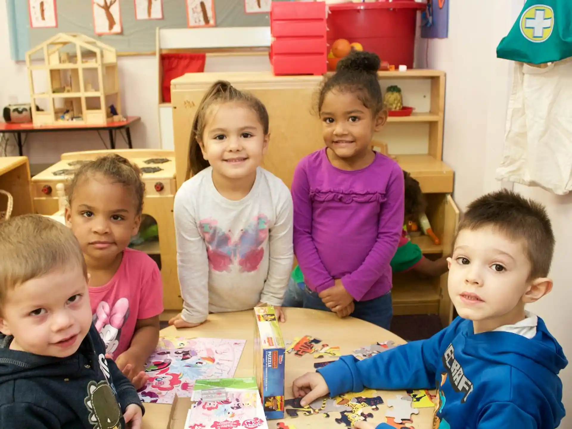 a group of children sitting at a table