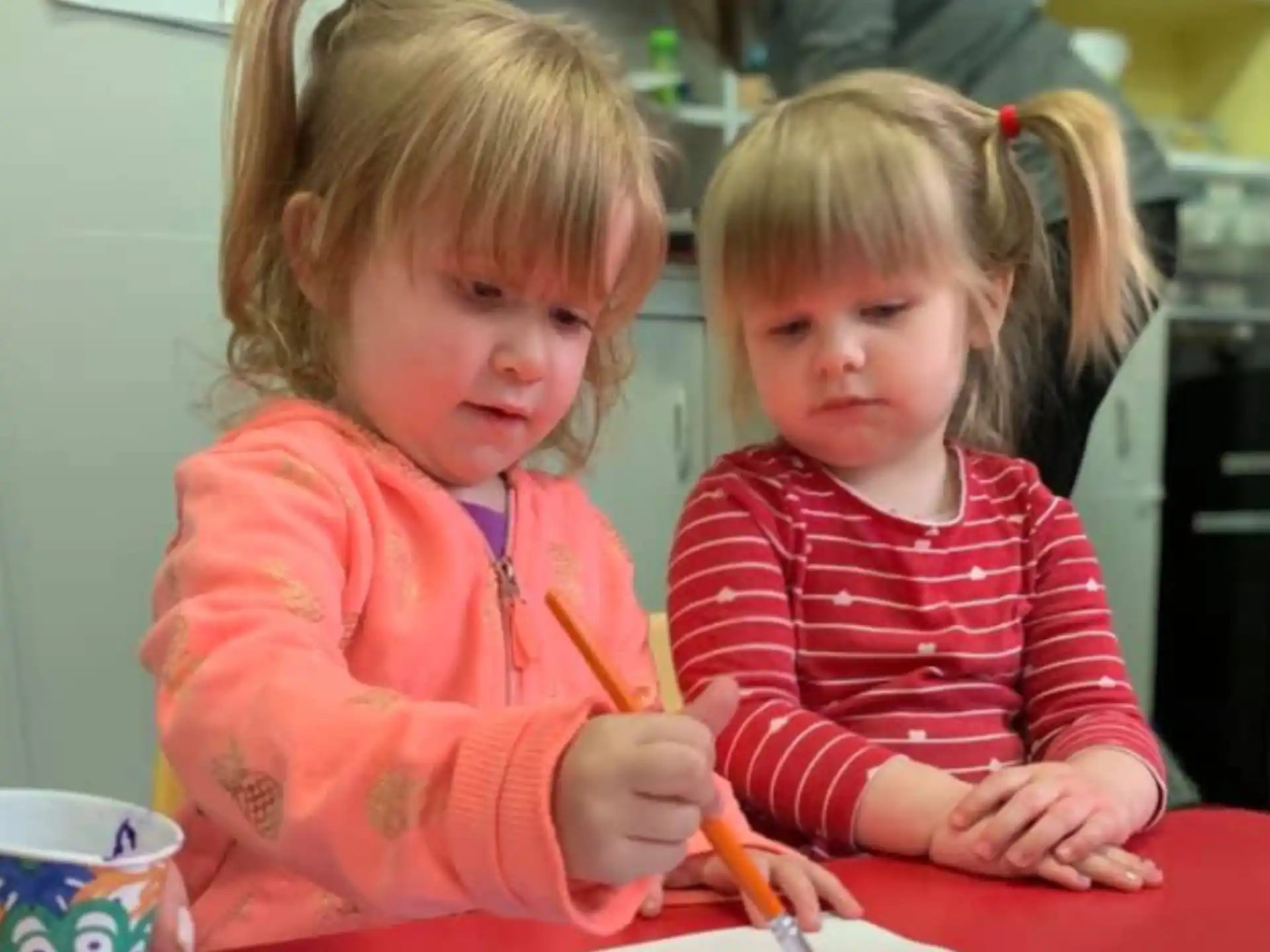 a couple of young girls painting