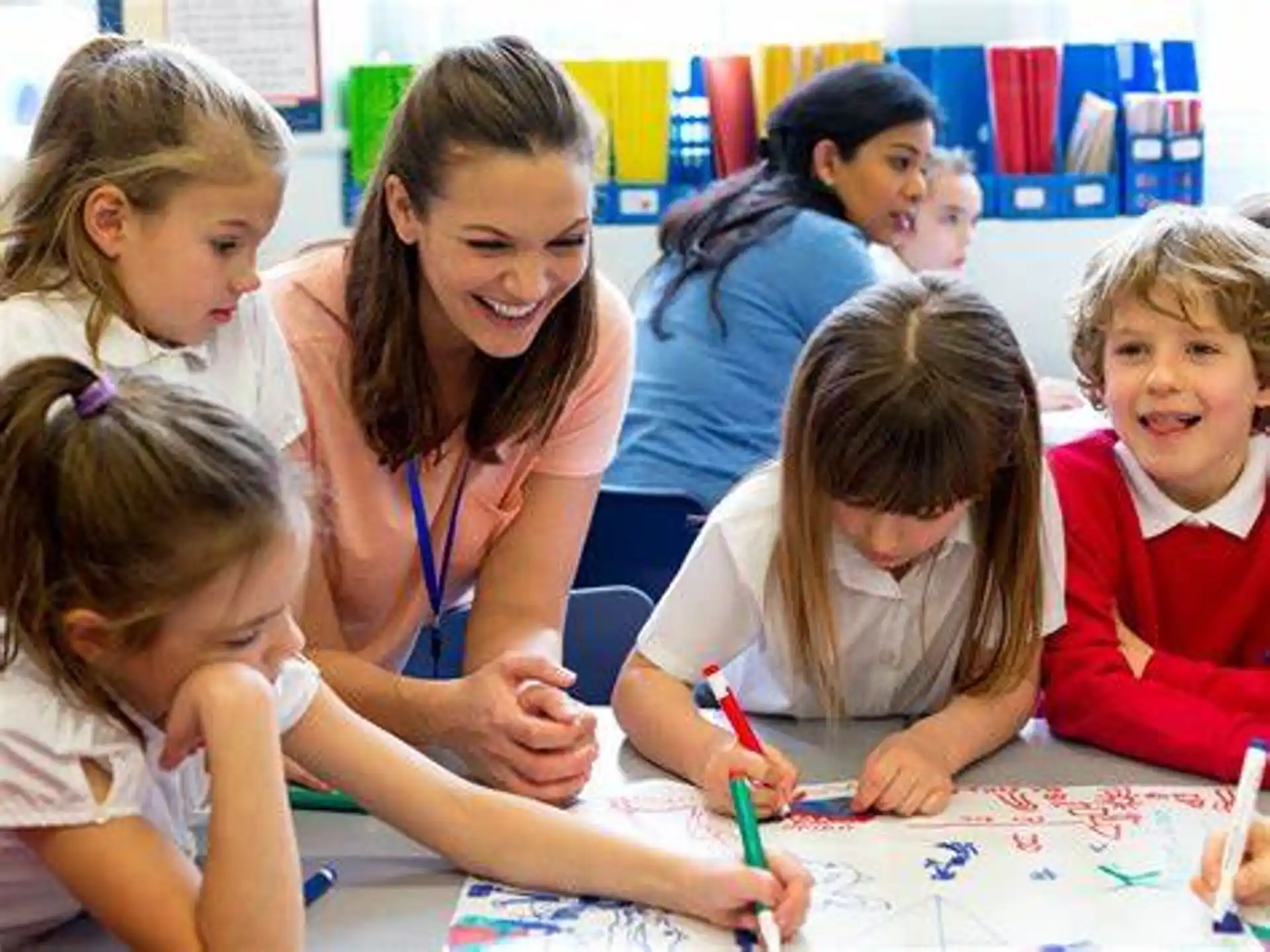 a teacher teaching her students