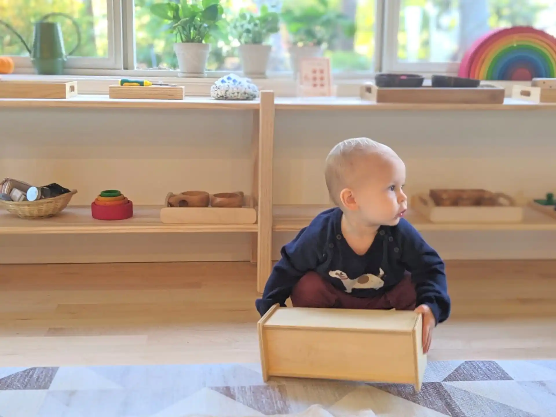 a baby sitting in a box