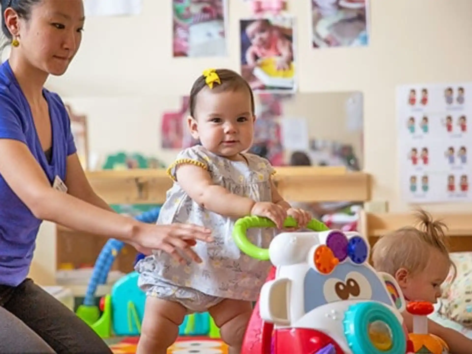 a person and a child playing with toys