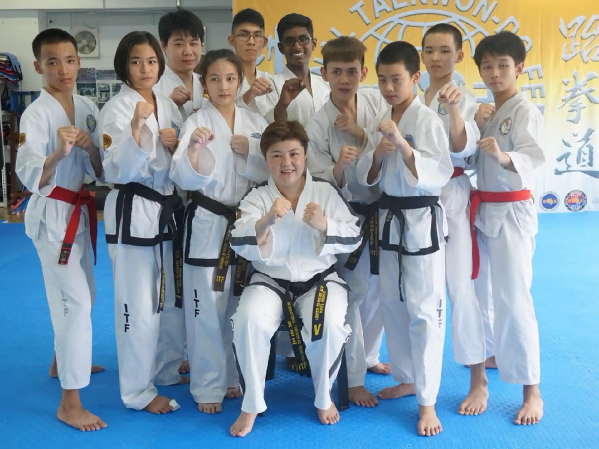 a group of people in karate uniforms