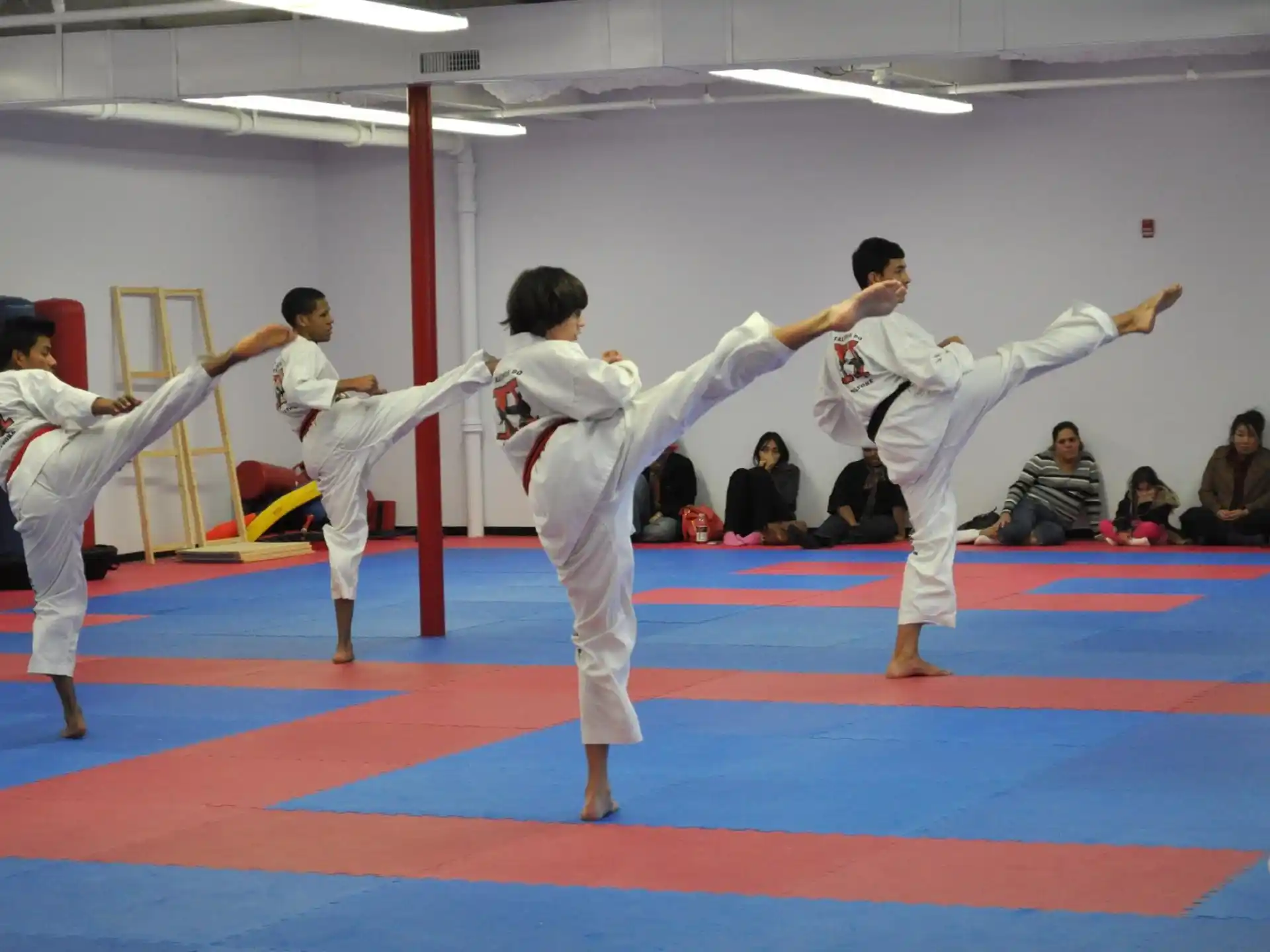 a group of people in karate uniforms