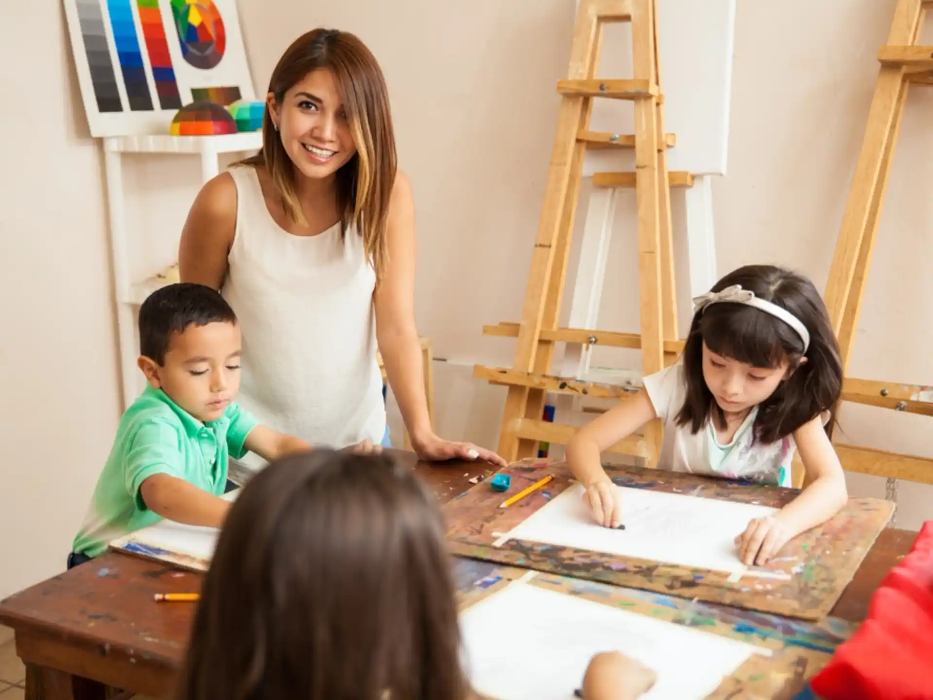 a woman and children sitting at a table