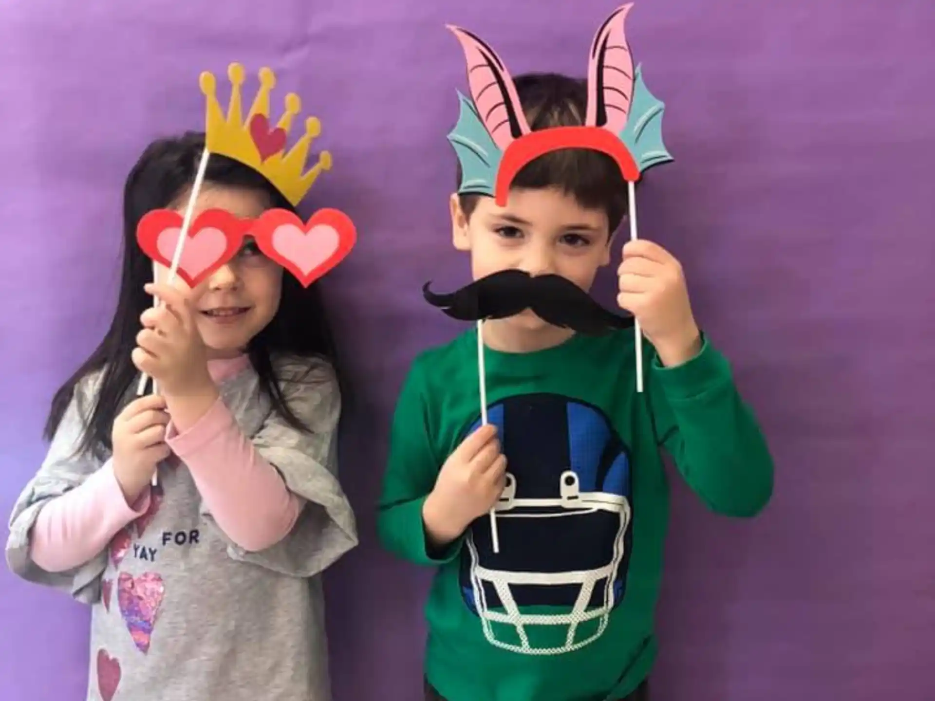 a couple of children wearing clothing