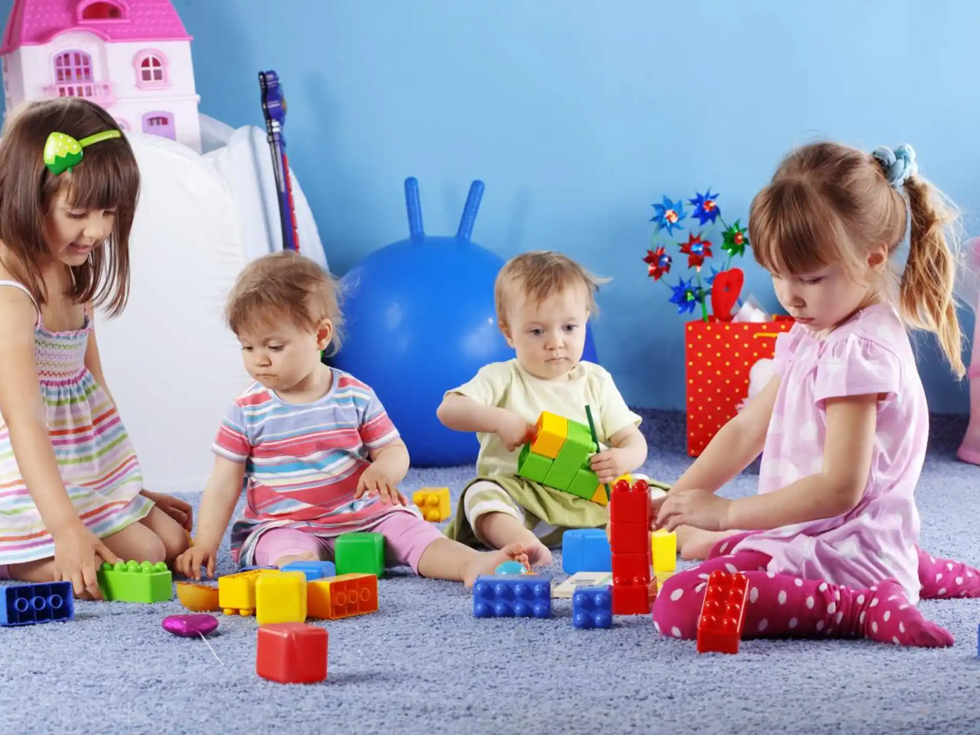 a group of children playing with toys