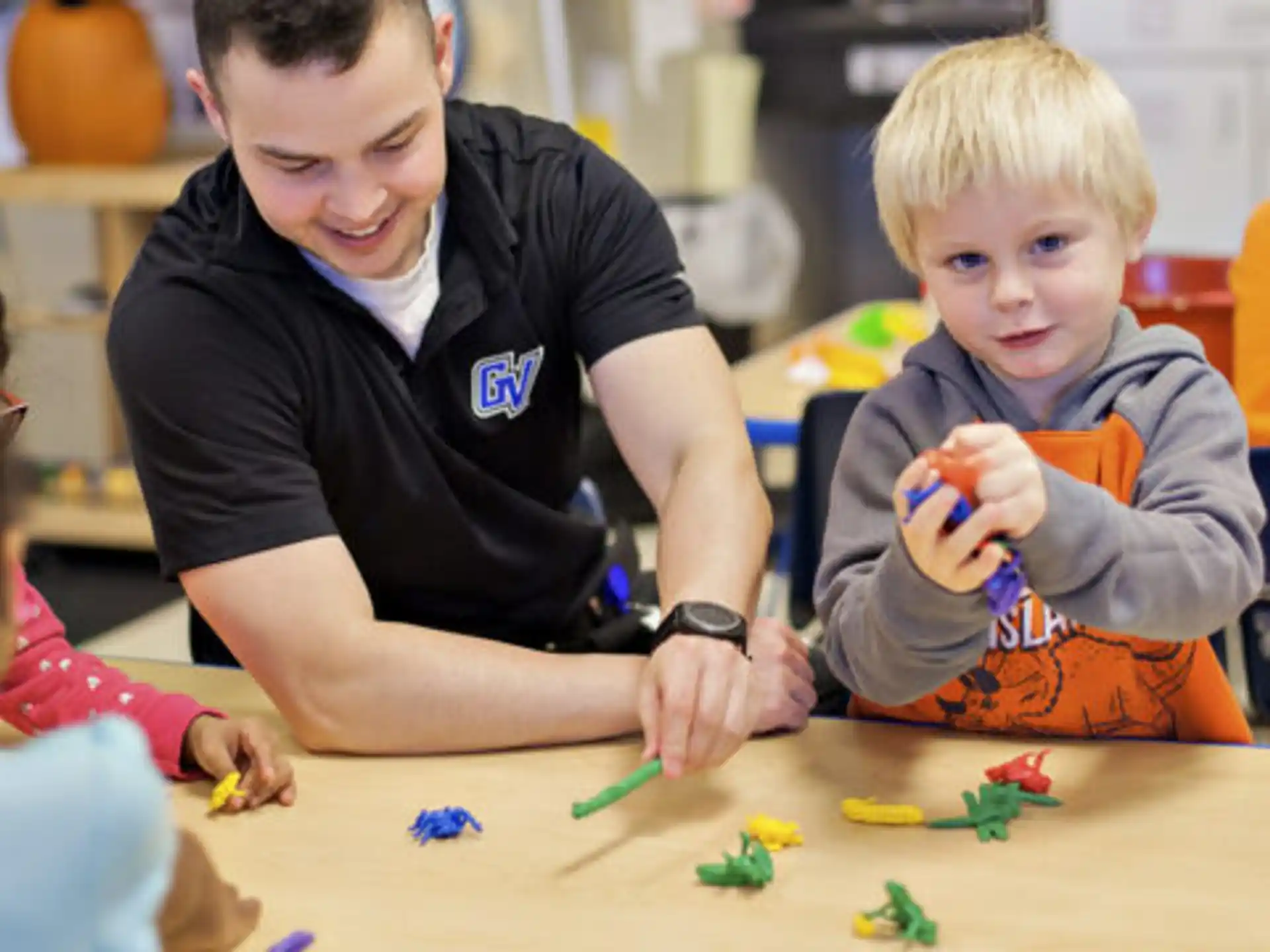 a group of children playing with toys