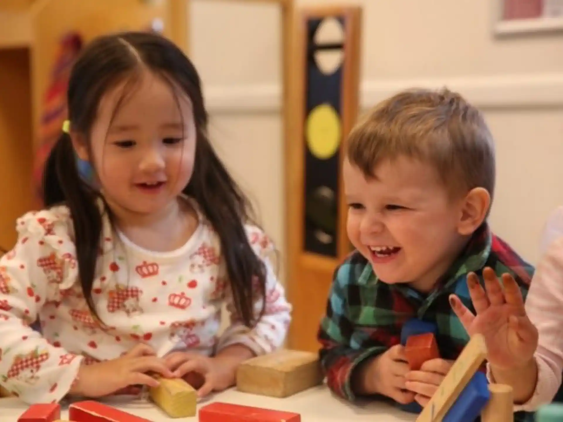 a couple of children playing with toys