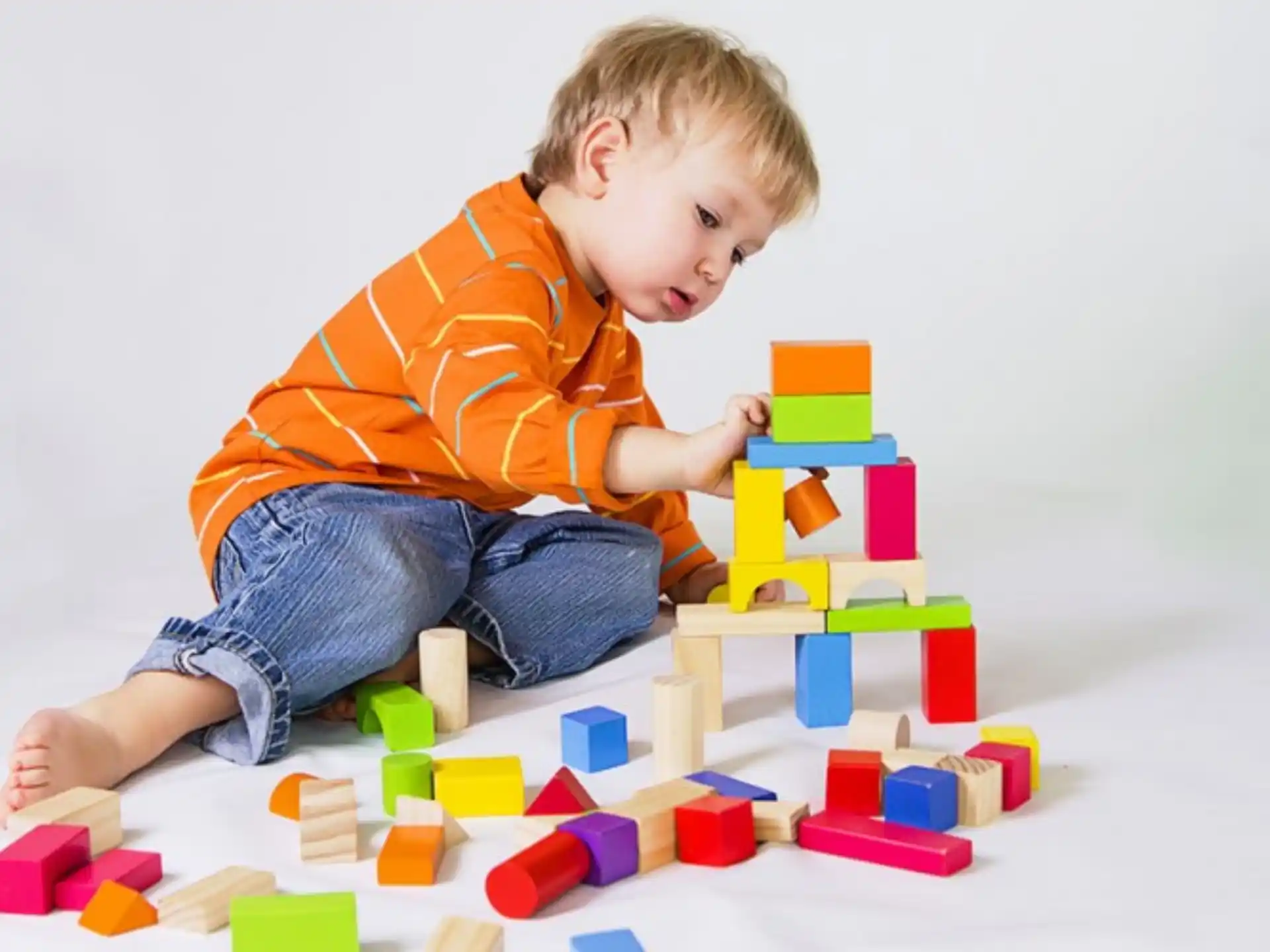a baby playing with blocks