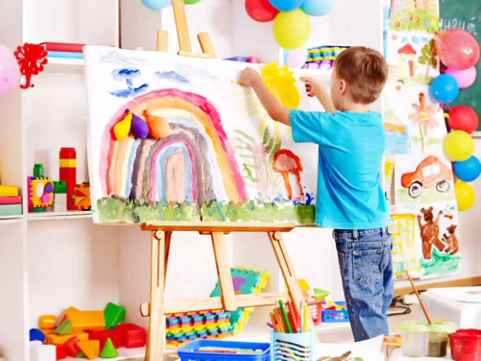 a child painting on a canvas