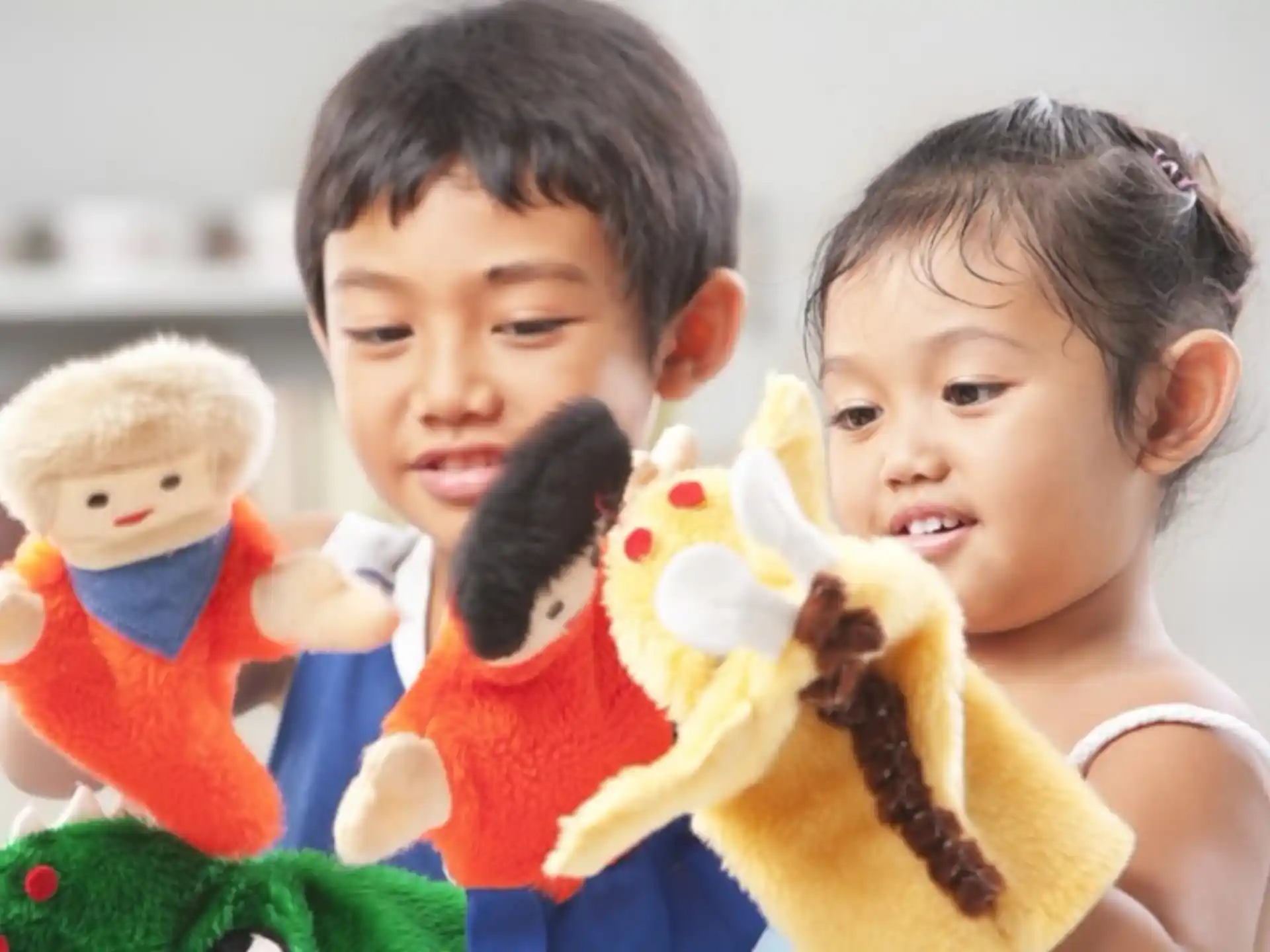 a couple of children holding stuffed animals