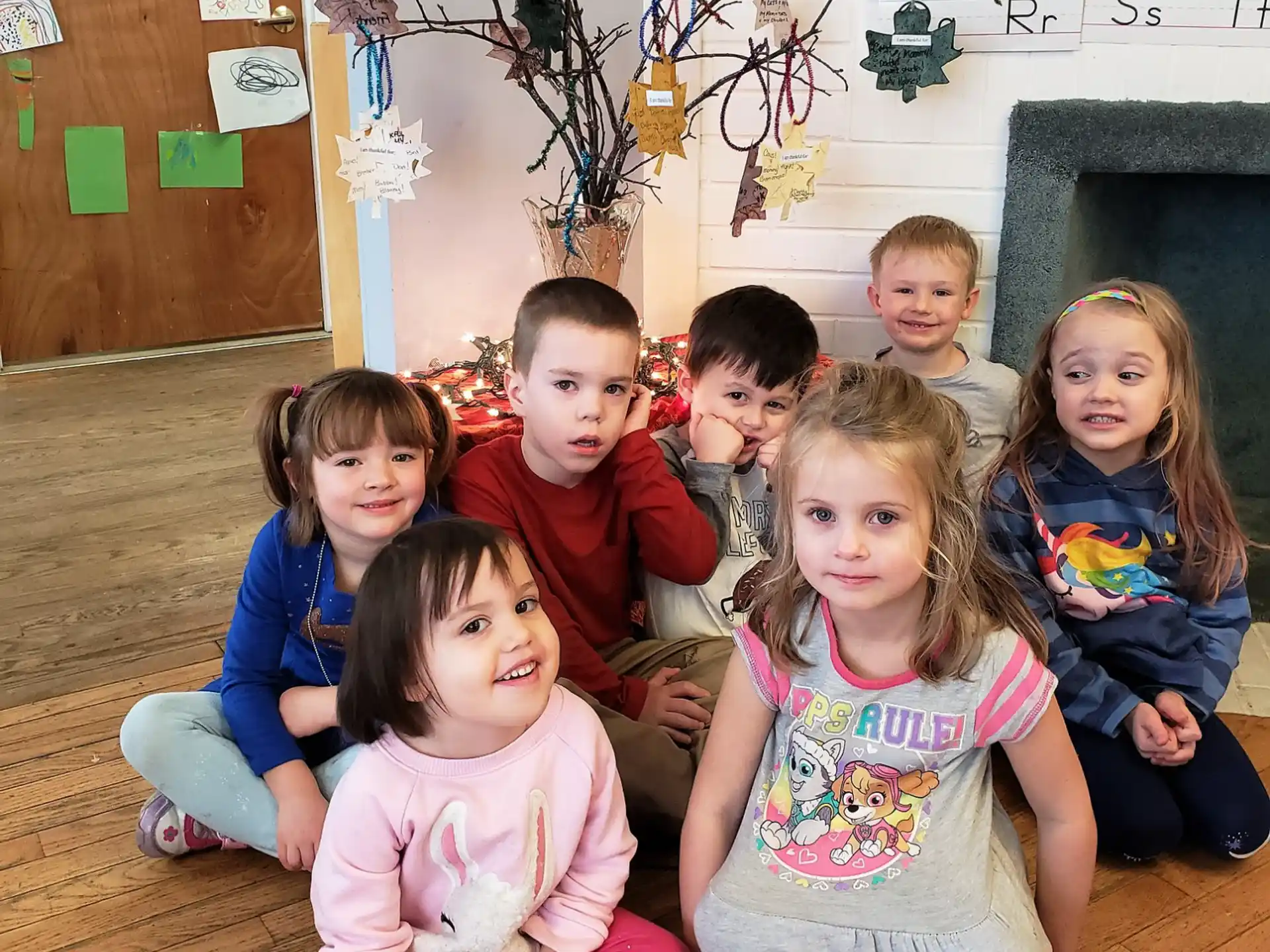 a group of children sitting on the floor