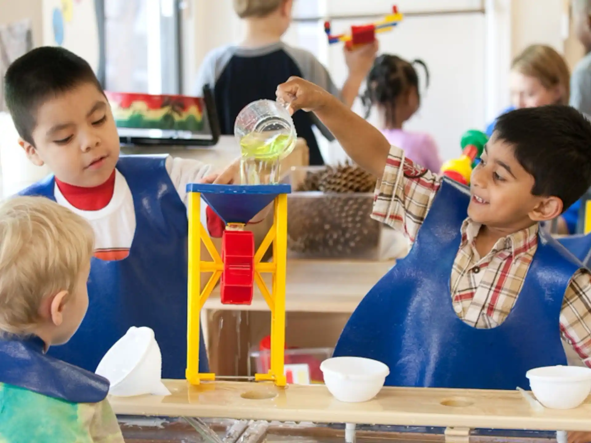 a group of children sitting at a table