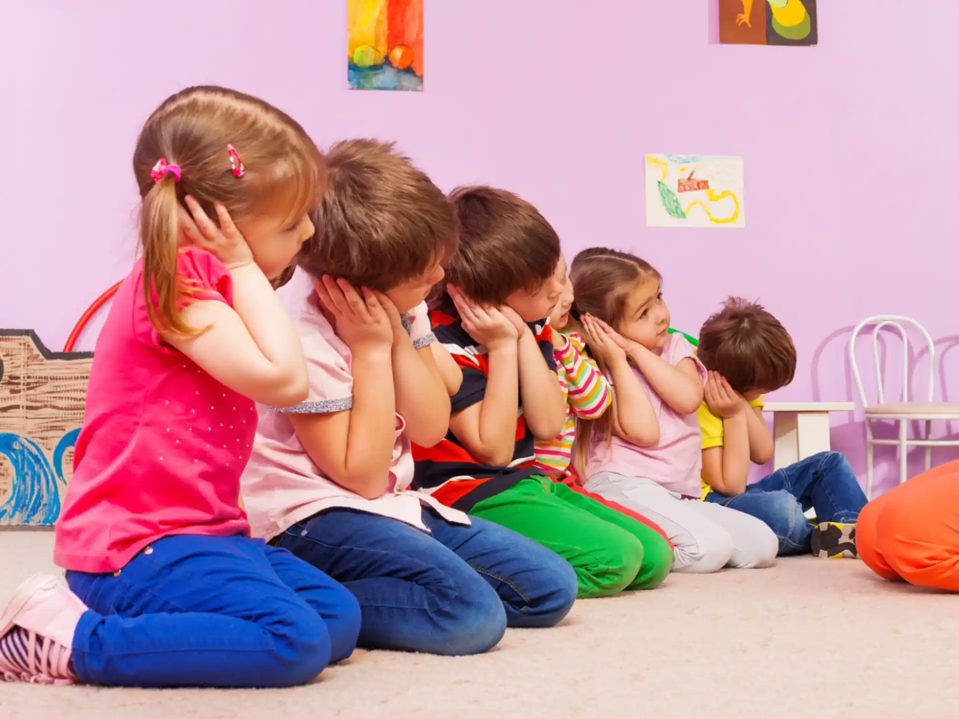 a group of children sitting on the floor