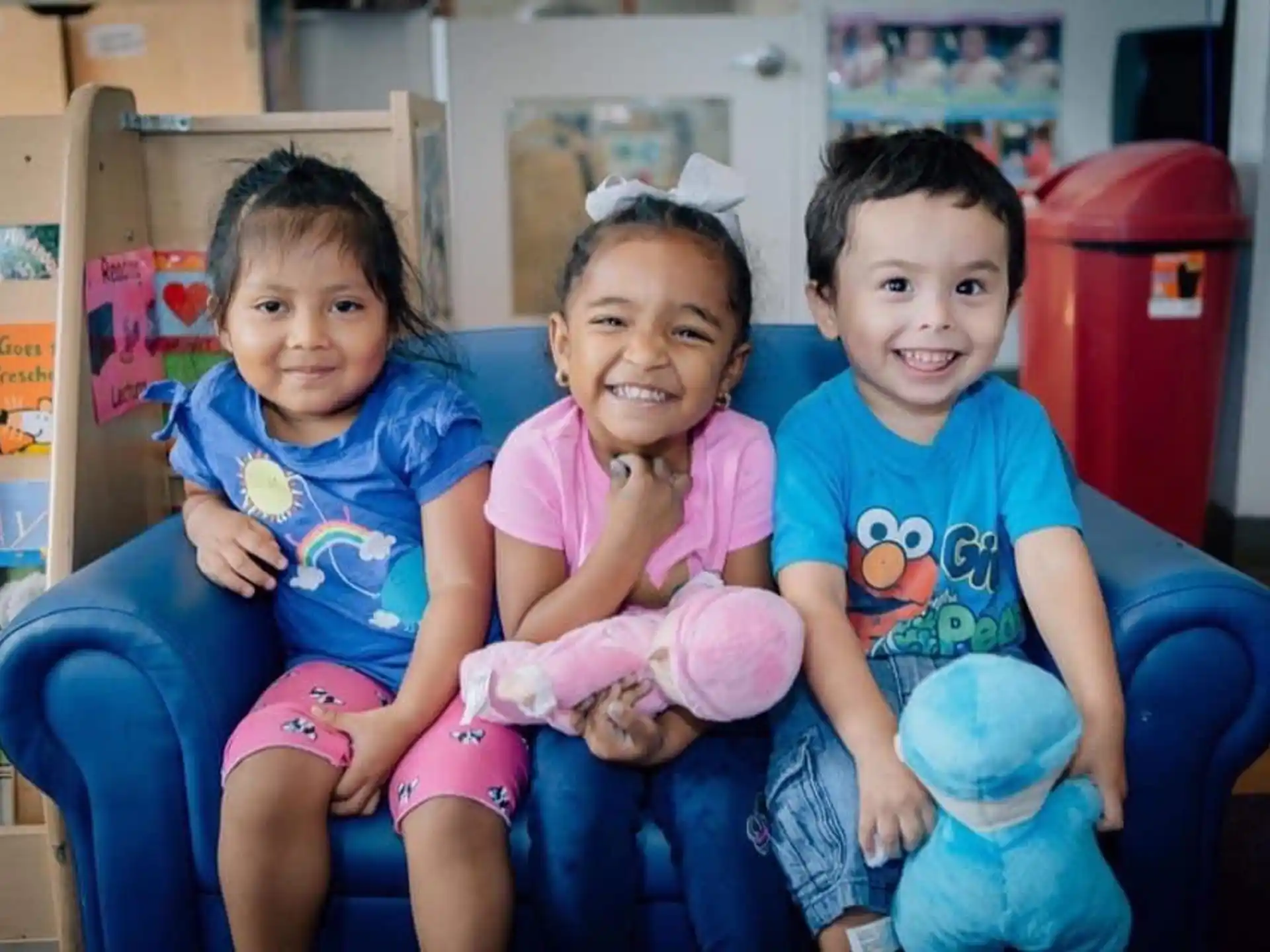 a group of children sitting on a bench