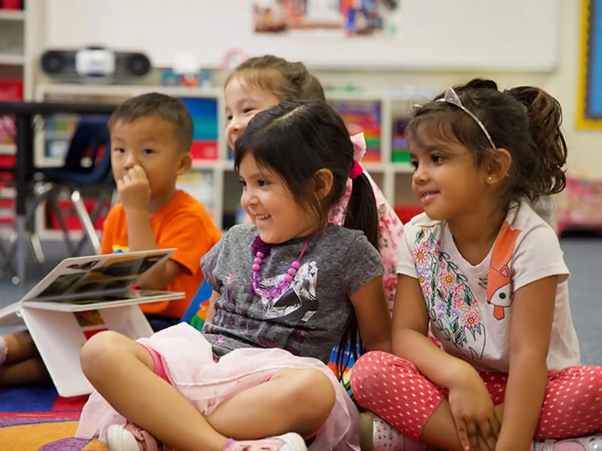 a group of children sitting on the floor