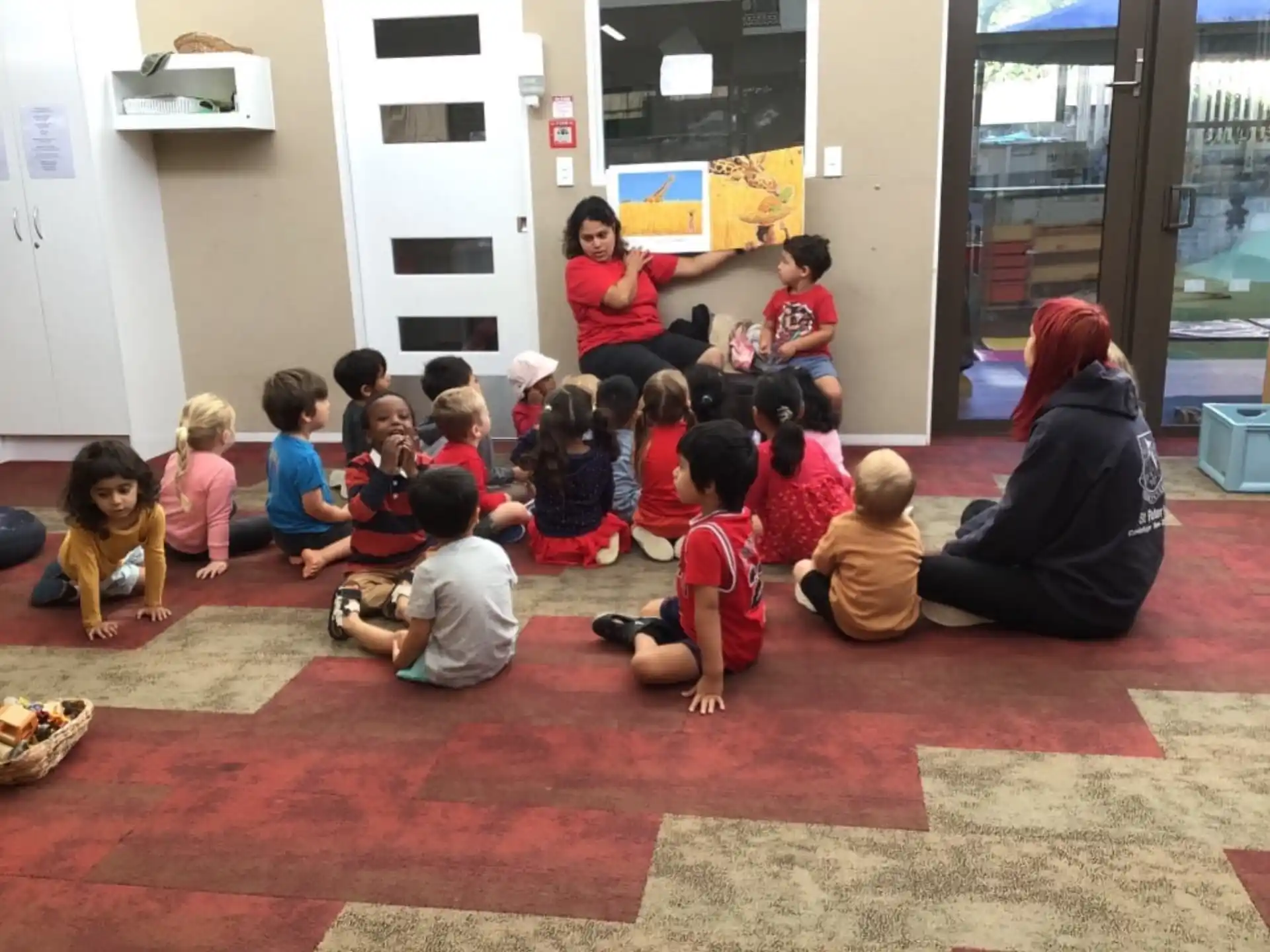 a group of children sitting on the floor