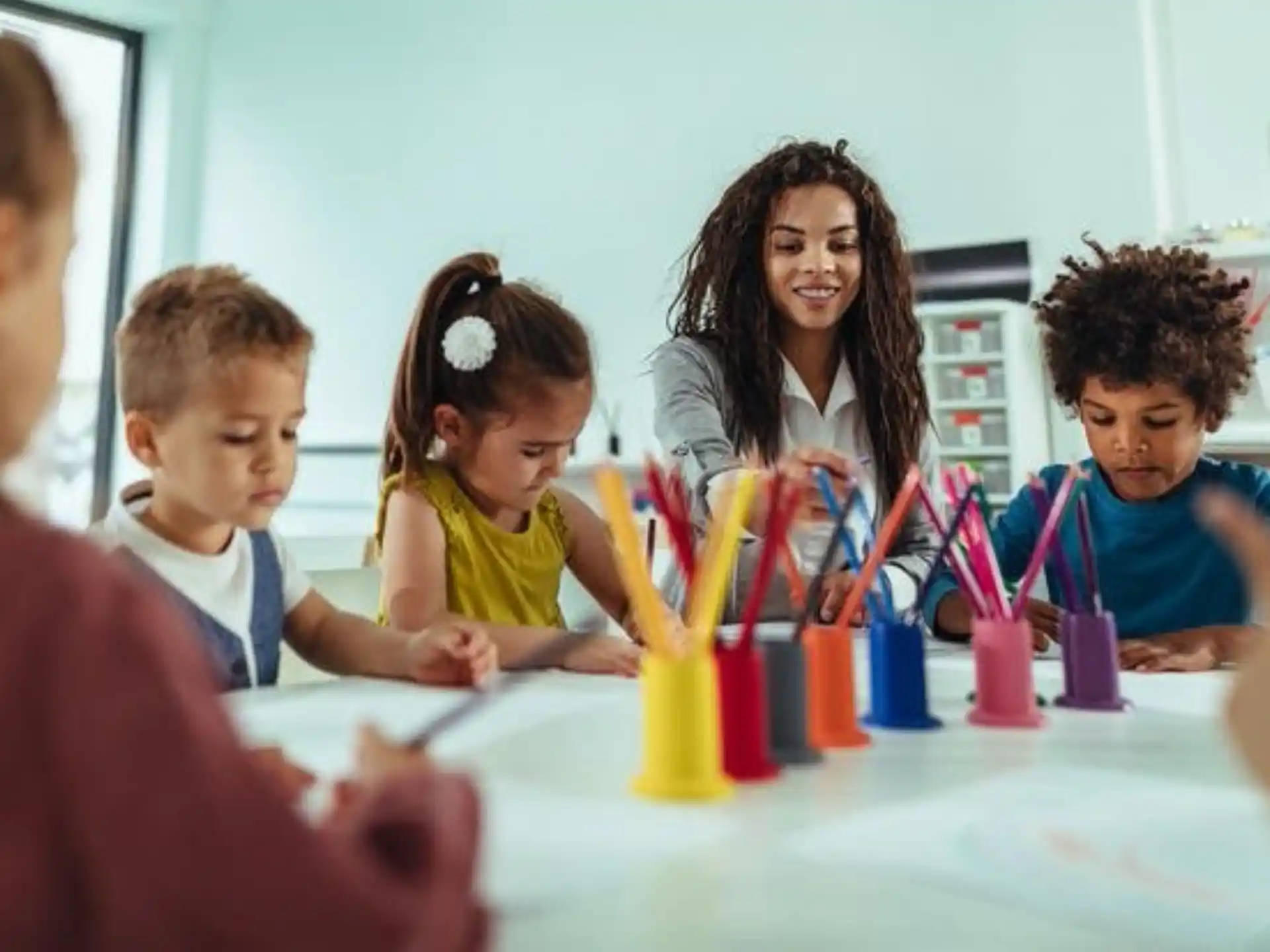 a group of children sitting at a table