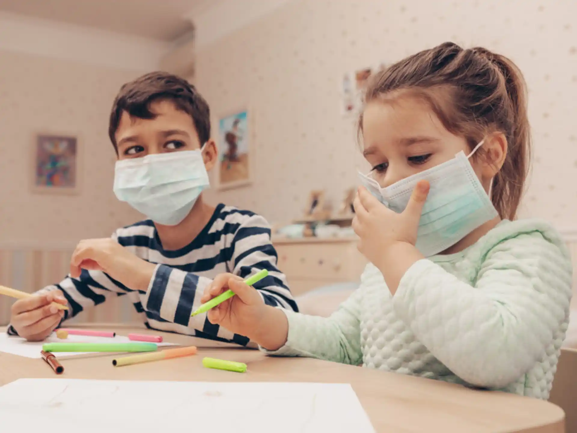 a couple of children painting