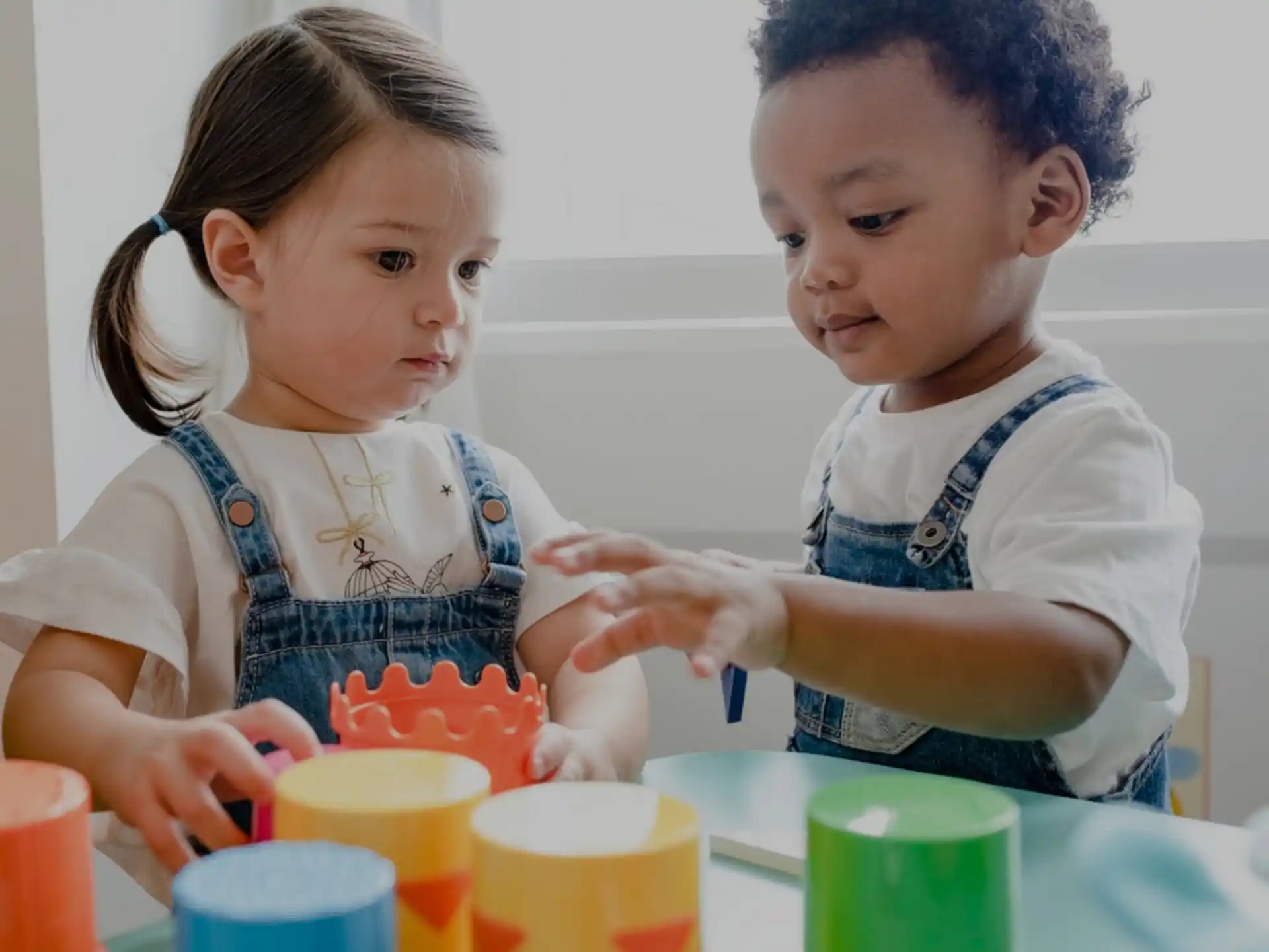 a young girl and a young boy painting
