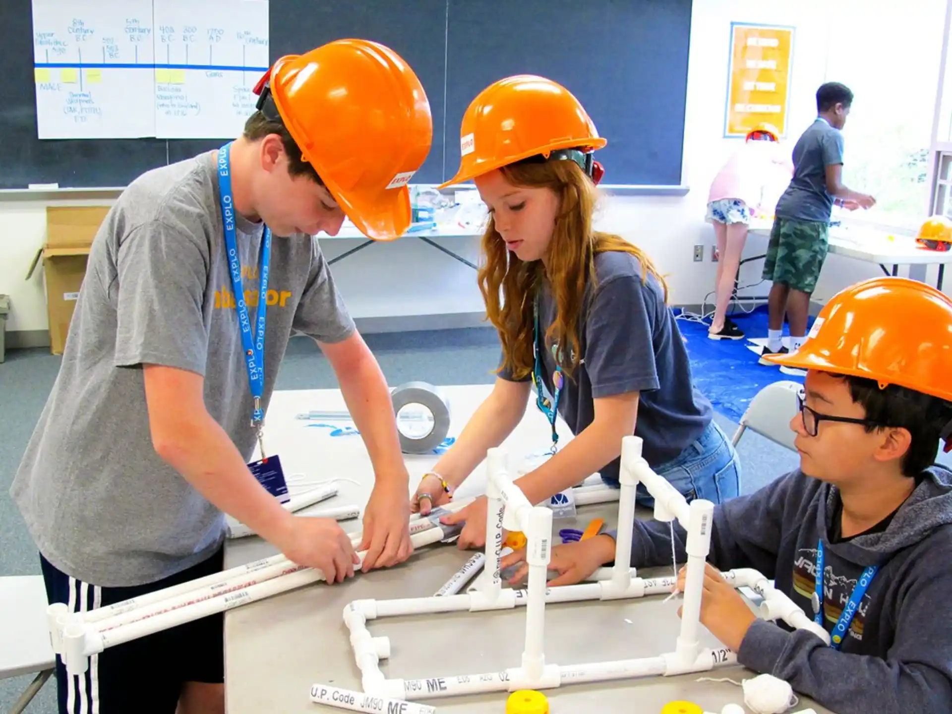 a group of people wearing hard hats