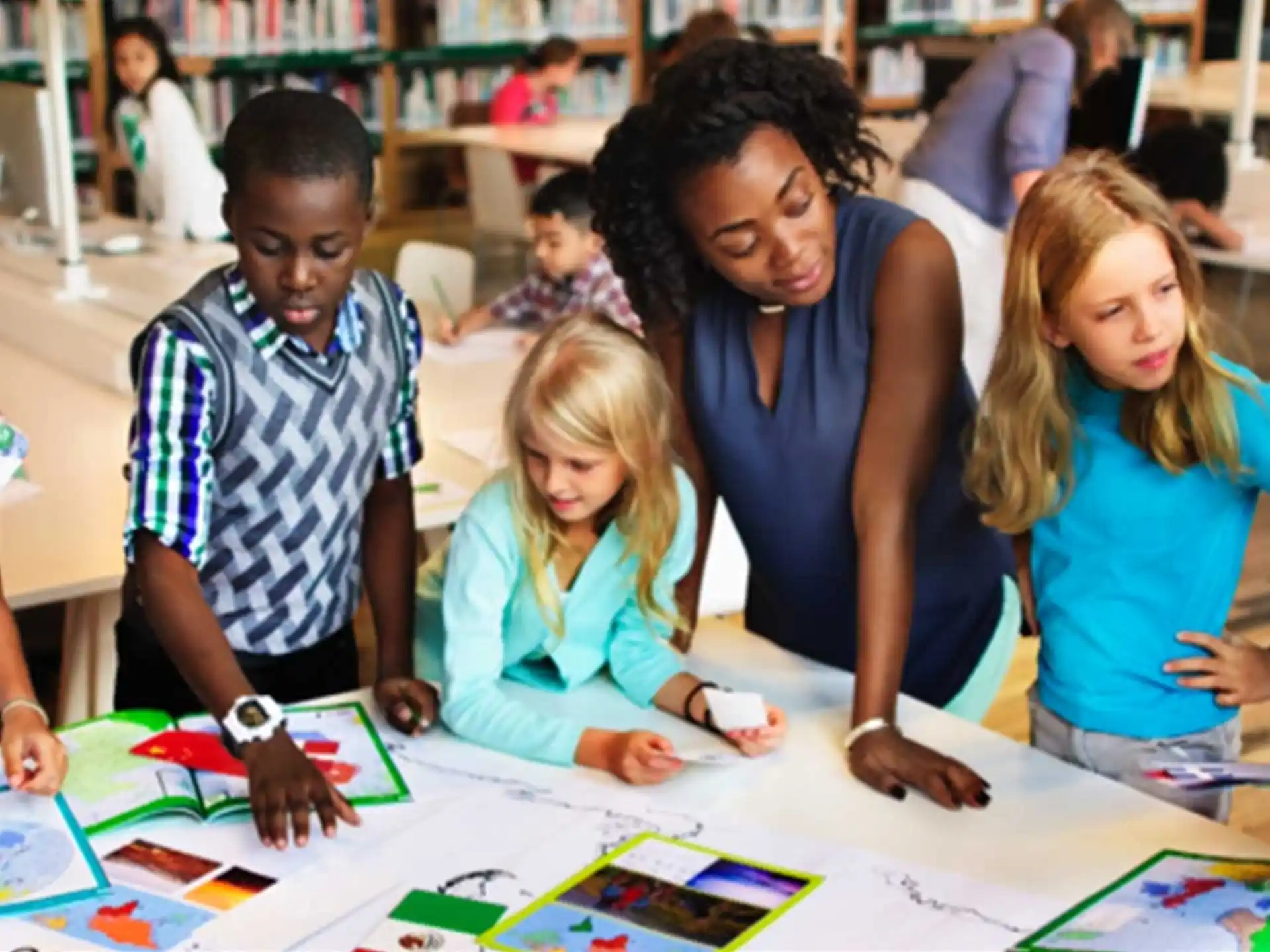 a group of children sitting at a table