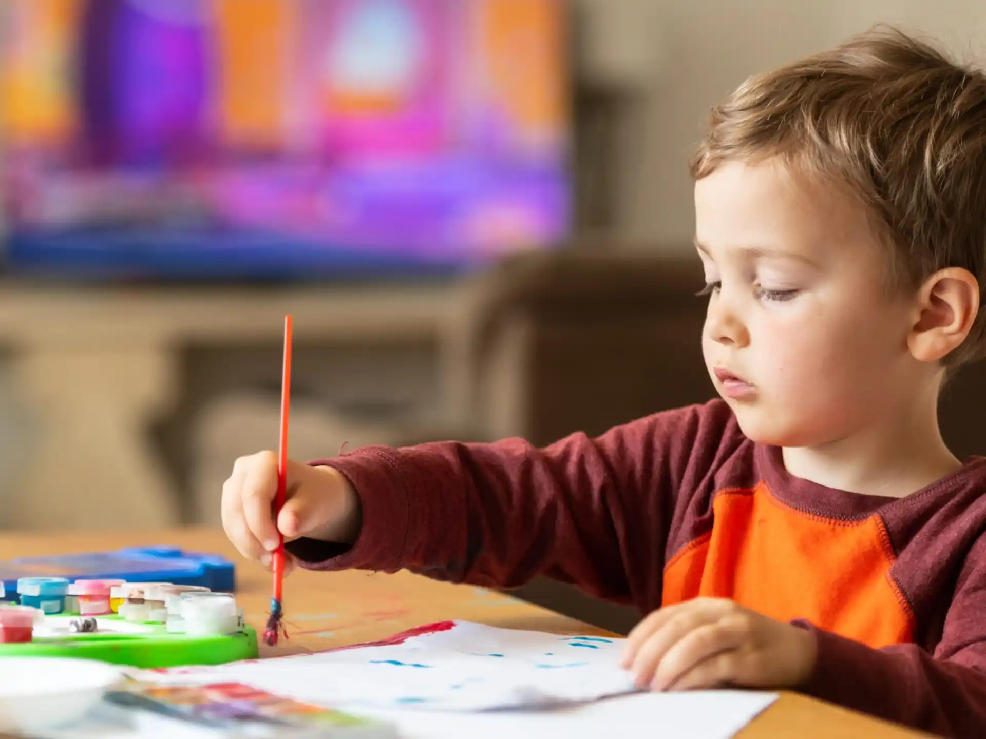 a child coloring on a paper