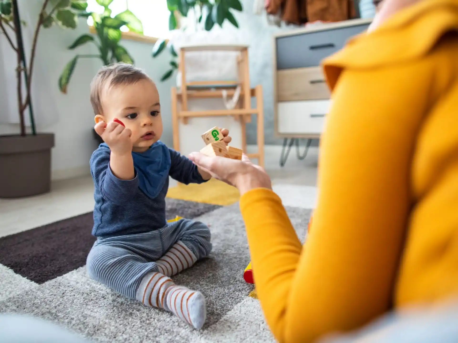 a baby sitting on the floor