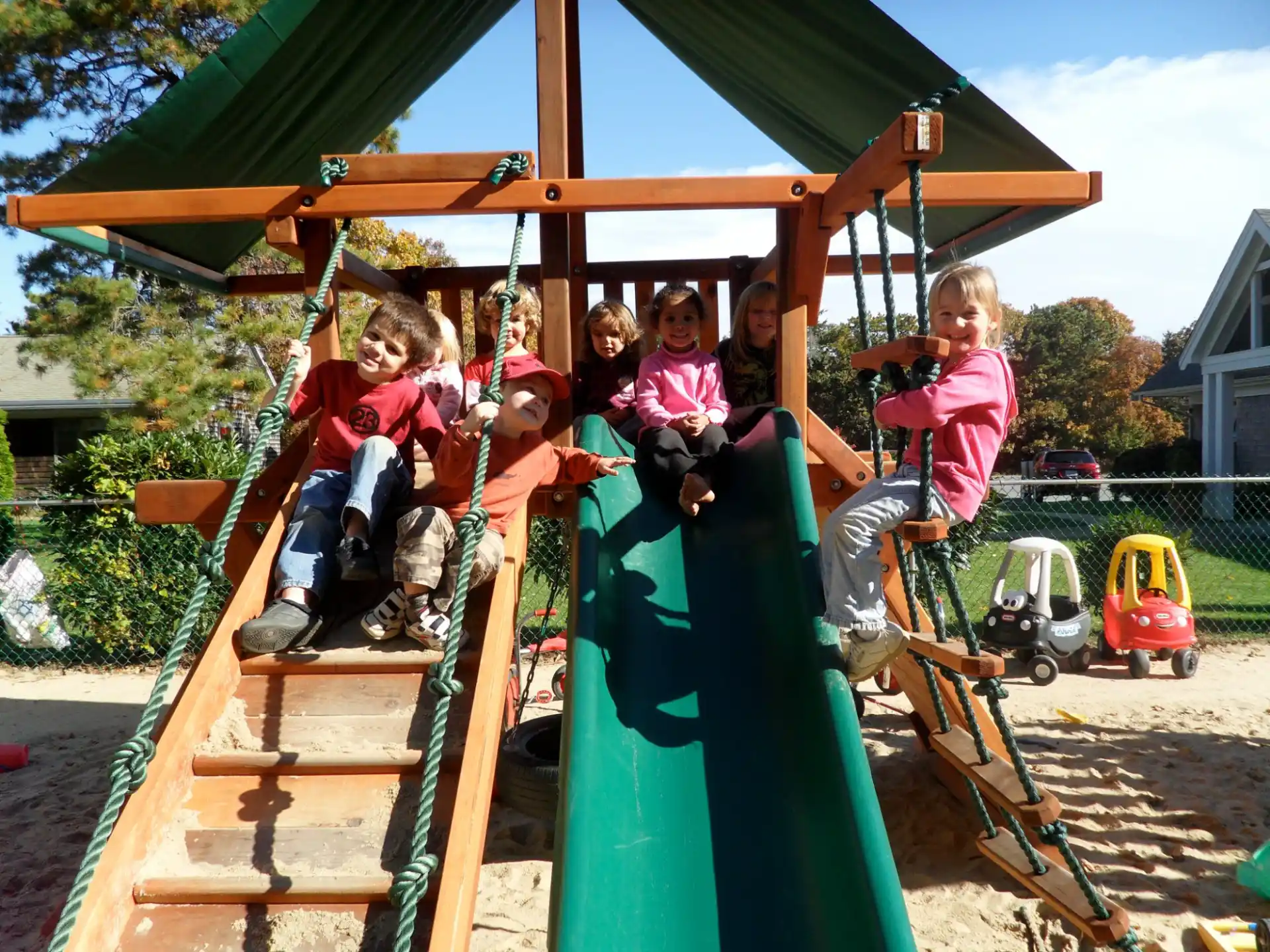 a group of children on a swing