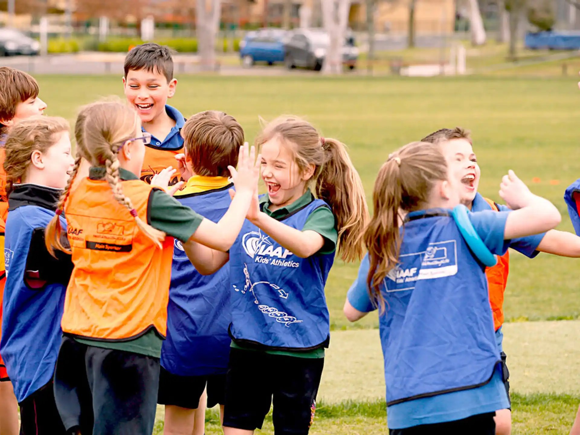 a group of kids in a field