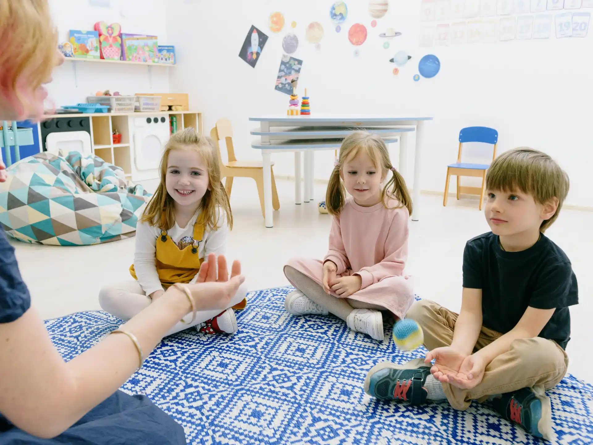 a group of children sitting on the floor