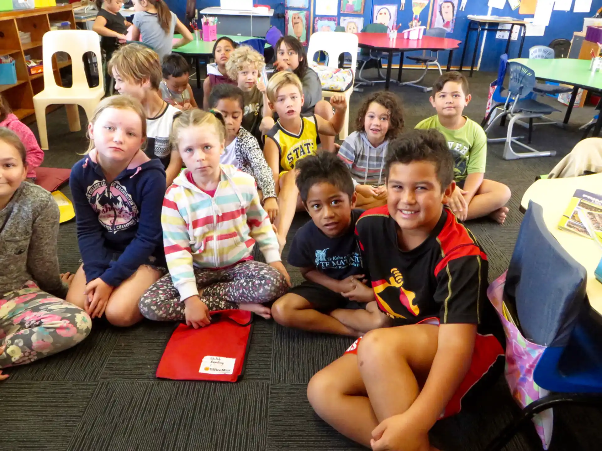 a group of children sitting on the floor